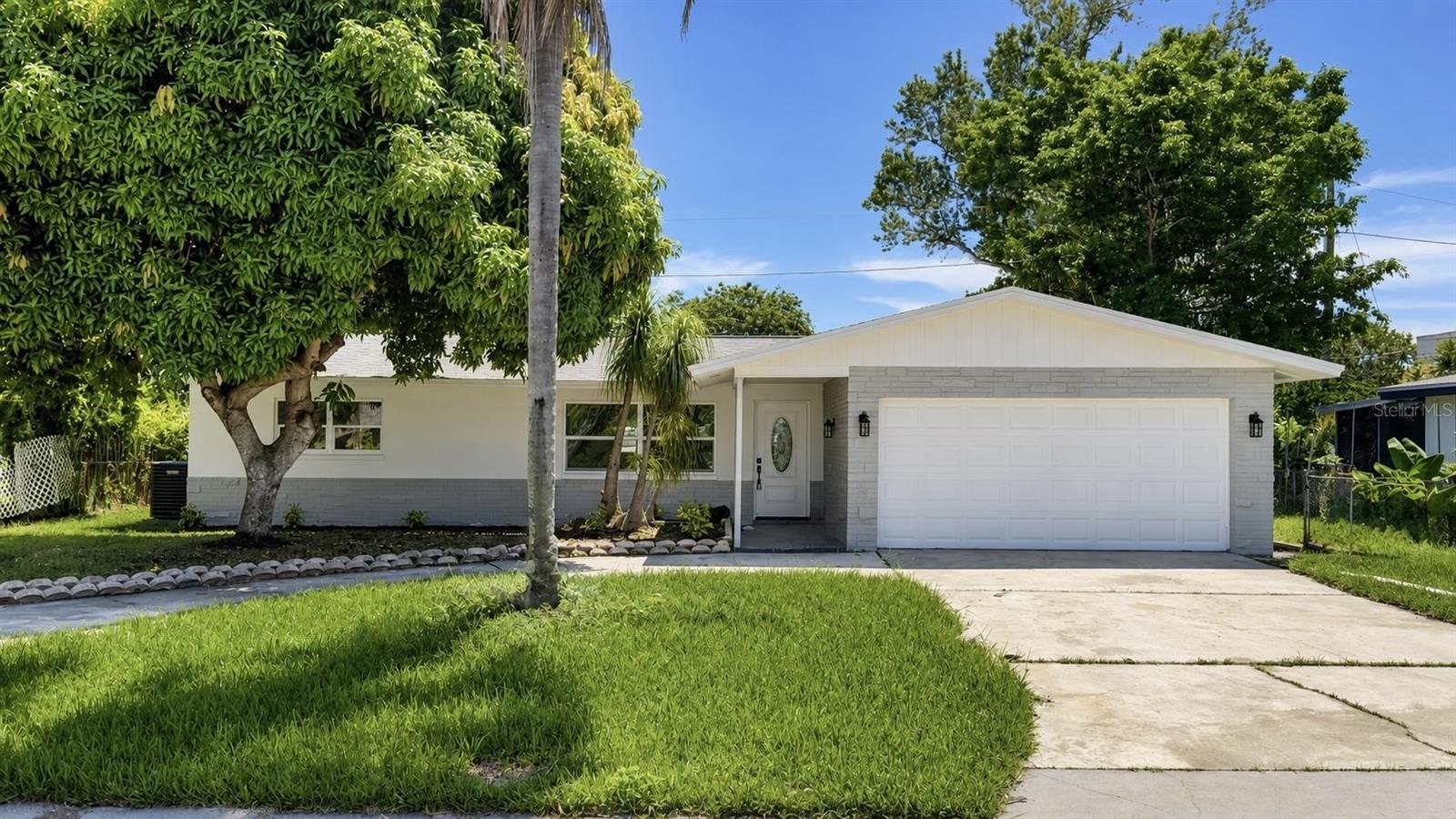 Welcome to 1421 Heather Dr, Dunedin!Beautifully renovated and move-in ready, this inviting Dunedin residence combines contemporary style, versatile living space, and a peaceful Florida setting. Positioned across from a tranquil freshwater canal, the home offers thoughtful updates and everyday comfort in a desirable location.Inside, natural light fills the open living areas, complemented by new flooring and a seamless flow throughout the main spaces. The remodeled kitchen is a standout feature, offering elegant quartz countertops and a dramatic waterfall edge island that creates the perfect setting for entertaining, dining, or casual gatherings.A spacious bonus room adds valuable flexibility and can be used as a home office, guest area, media room, hobby space, or additional living area.Both bathrooms have been tastefully updated with modern fixtures and finishes. Large windows bring in abundant sunshine while providing pleasant views of the canal and surrounding greenery.The generous lot offers ample space for outdoor entertaining, gardening, relaxing, or enjoying the Florida sunshine. A two car garage provides convenient parking and additional storage.Located in desirable Dunedin, the property is close to restaurants, shopping, parks, recreational activities, downtown, and the area's beautiful Gulf beaches. Whether you're seeking a full time residence, seasonal retreat, or Florida getaway, this home delivers comfort, convenience, and versatility.With extensive renovations, an impressive kitchen, updated bathrooms, new flooring, abundant natural light, a flexible bonus room, two car garage, generous lot, and serene canal views, 1421 Heather Dr is ready to welcome you home.