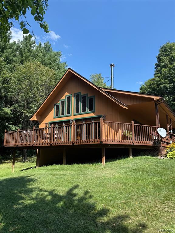 A Unique and welcoming 10-Acre Retreat with Pond, Trails and Wildlife sits high overlooking the serenity and privacy found here. 
Escape to your own secluded paradise!  This beautiful wood exterior style home with a warm knotty pine interior is perfectly set on peaceful acreage featuring a private pond, nature trails and a great place to get your next BIG BUCK. Hunting is one of the things most enjoyed here. Birds, turkeys, deer and all other game gathers here.  
Inside, you'll find 3 bedrooms and 2 baths, plus a finished walkout basement with a home office and workout room. Big enough to be a bedroom in the Basement as well making it 4 bedrooms. FIRST FLOOR LAUNDRY is also a bonus. Recent updates make this home truly move-in ready:
*Bathrooms remodeled in 2024
*New carpeting in 2023
*Central air installed in 2023
*Exterior painted in 2022
*Repainted with the last few years
*Basement Carpet in 2023
*Gutter Guards 2023*
*Countertops 2022
The main living space opens to a beautiful covered porch overlooking the pond, perfect for morning coffee or evening sunsets. A large 3-car garage with all new electrical and a workshop behind offers plenty of room for vehicles, tools and toys.  Whether you're looking for a full-time residence or a weekend getaway, this property offers the peace, privacy and natural beauty you've been dreaming of.  This home is within 2 miles of I69 for easy access to Oakland and Macomb county and 5 miles to Lapeer for shopping and dining. This home has nothing to do to move into it but hang your clothes and start the fire in the stove while the leaves fall. Such a large but yet cozy home. 
Schedule your private tour today - there are very few homes with this much charm and privacy out there.