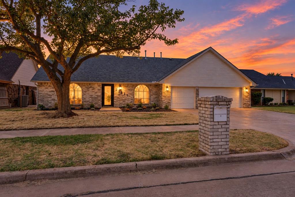 Beautifully remodeled 4 bedroom 3.5 bath home in Moore School District offering a fresh, contemporary design and an impressive amount of living space. From the moment you enter, you'll notice the clean modern finishes, warm flooring and thoughtfully updated interior. The spacious open-concept living area flows beautifully from the living room, kitchen and dining room for ample living and entertaining areas. Large windows and doors bring in abundant natural light and provide a great connection to the backyard. This home features four bedrooms and three-and-a-half beautifully remodeled bathrooms, each with its own distinctive style. Designer tile, modern vanities, updated fixtures, dramatic shower surrounds and sophisticated black and brushed-gold accents give the bathrooms a custom feel. The primary bath offers an especially impressive spa like retreat with a freestanding tub, oversized shower and generous vanity space. A modern staircase with wood and metal railing adds architectural interest, while the neutral color palette throughout makes the home feel bright, cohesive and move-in ready. Outside, the attractive brick exterior, mature shade tree and updated landscaping create wonderful curb appeal. With 4 bedrooms, 3.5 baths, multiple living and entertaining spaces, stylish renovations and a desirable Moore School District location, this home combines character, functionality and modern design in one exceptional property.