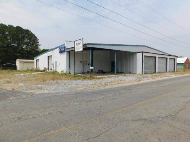 This versatile commercial property is ideal for automotive businesses, repair shops, or light industrial operations. The facility features five large roll-up doors, providing easy access for multiple service bays and allowing for simultaneous vehicle servicing. With an open floor plan and durable construction, the property accommodates mechanics, service equipment, and vehicle storage efficiently. Call today for a showing!   5 roll up doors, spacious bay area, & office area  Suitable for auto repair, detailing, body shops, tire services, or               other commercial applications  Conveniently located  Opportunity to expand