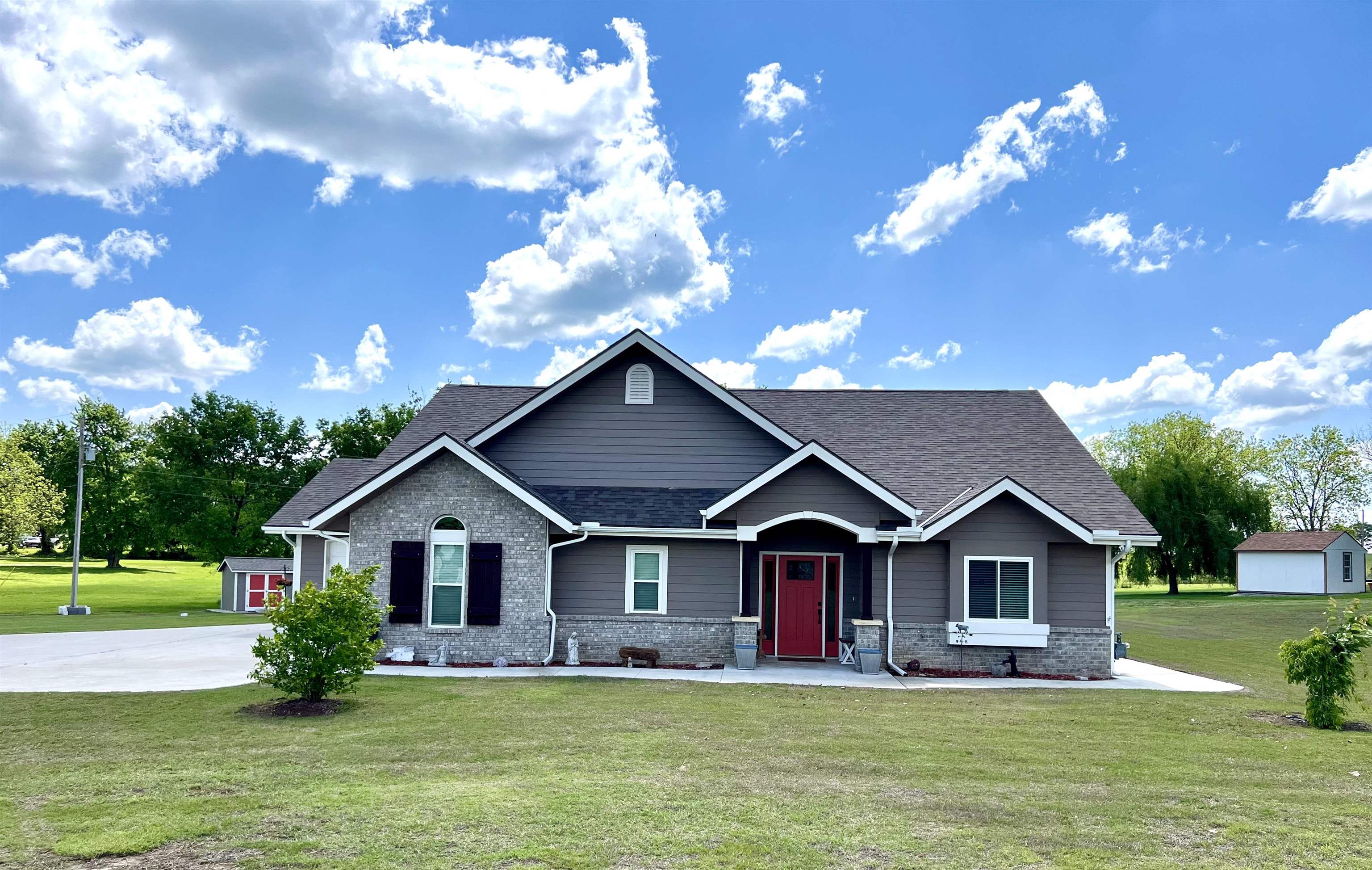 HOT LISTING IN PARKERFIELD!!!Nestled on 1.7 acres, this stunning custom built home offers the best of the best in both function and design. Every detail was thoughtfully planned – from exterior wiring for Christmas lights with an indoor switch and timer to ADA Accessible with 3ft wide doors.   As you enter the zero entry layout, you'll be welcomed by vaulted ceiling and a built in bench perfect for guest to hang their hat. At the heart of the home is a beautifully designed kitchen featuring high-end Bosch stainless steel appliances, granite countertops and a sleek stainless steel farm sink. The eat up bar makes breakfast and casual mails a breeze, all while flowing seamlessly into the cozy open – concept living room area , perfect for entertaining and relaxing. Step outside and enjoy the screened in porch which leads to a fenced backyard ideal for pets and kids. Prepare to be WOWED by this master suite! Oversized windows, bathe the room with natural light, while the spa like master bath includes dual vanities, a luxurious standalone soaking tub,  and a zero entry walk-in shower. The master closet doubles as a storm shelter for your peace of mind....It's smart design. The guest bedroom is ideal for family and guests or double as a home office.  Garage lovers take note: This one goes above and beyond. Features include: A 3 car garage that is fully insulated and heated,  a  battery back up for the door opener, attic fan, floor draines,  refrigerator and freezer , steel cabinets the list goes on. If Security is important to you, the home is equipped with seven exterior security cameras watching over you 24/7. Need more convincing? Call listing agent to set up your personal Showing so you can see this one of a kind property for yourself.