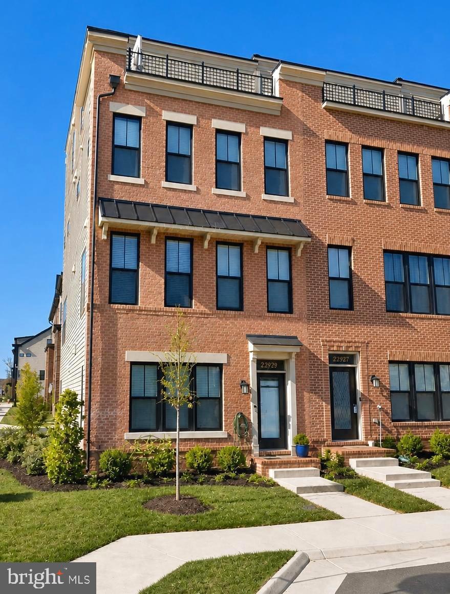 Welcome to this premium 4-level end-unit townhome, ideally located just steps from Brambleton Town Center. East-facing and offering approximately 2,756 sq ft of beautifully upgraded living space. This home features 3 bedrooms, 3 full baths, 2 half baths, a  spacious loft, rooftop terrace, and over $80k in upgrades.The home showcases an open-concept layout with high ceilings, a light-filled living and dining area, and a chef-inspired kitchen complete with high-end quartz countertops, stainless steel appliances, extra upgraded cabinetry, and an extra large island. Enjoy cozy evenings by the fireplace or step out onto the extended balcony for outdoor relaxation. Upstairs, you’ll find two spacious primary suites, each with its own full bath, including a luxurious owner’s suite with a large walk-in closet with custom closet system. A conveniently located laundry room completes this level. The top floor offers a third bedroom, full bath, expansive loft, and a bar/kitchenette, along with access to a private rooftop terrace perfect for entertaining or enjoying outdoor living in the heart of Brambleton.Situated on a premium corner lot with park views this home offers the perfect blend of comfort and modern living in one of Brambleton’s most sought after locations. Just a short walk to Brambleton Town Center, you’ll have easy access to shopping, dining, fitness center and a library. Residents enjoy an exceptional lifestyle with miles of scenic trails, parks, playgrounds, sports courts, and more. The community also features multiple pools, perfect for lap swimming, relaxing, or hosting private gatherings. HOA dues include Fios high-speed internet, cable, and lawn maintenance for added convenience. This is a home you don’t want to miss!