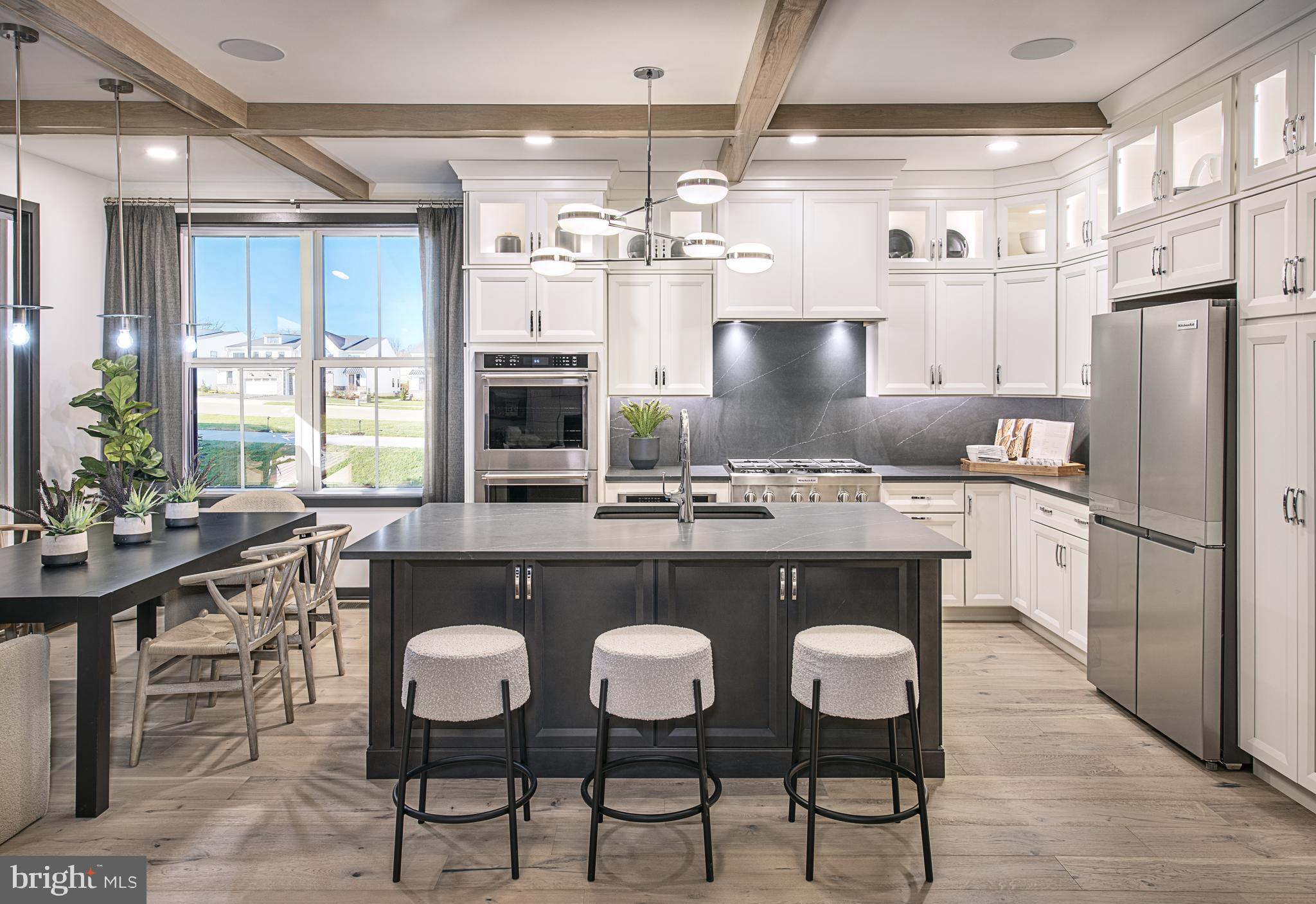The Willis Elite offers luxury and comfort within a well designed floor plan. Enter through the foyer to a spacious, open-concept great room that overlooks a large casual dining area and elegant kitchen that features a large island with breakfast bar and abundant counter space. Guests can enjoy a bedroom and full bathroom on the main level as well. On the second floor, the elegant primary bedroom suite boasts an impressive walk-in closet and a primary bath featuring dual sinks, linen storage, and a private water closet. Adjacent, the secondary bedrooms are enhanced by walk-in closets and share a hall bath. The Willis Elite also features a versatile second-floor loft, a private office off the foyer, easily accessible laundry, a powder room, and plenty of additional storage. This home includes the Designer Appointed Features and will be ready by September!