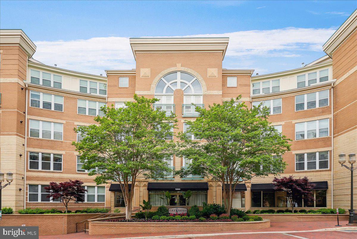 Beautifully updated 1BR/1BA condo in the highly desirable Savoy at Reston Town Center! Ideally located in the center of the building, this move-in-ready home overlooks the resort-style pool and beautifully landscaped courtyard, offering exceptional privacy and a peaceful setting. Enjoy relaxing on the private balcony while listening to the birds and taking in the tranquil views. Features include hardwood flooring in the main living area, newer carpet in the bedroom, a spacious walk-in closet, upgraded granite countertops, stainless steel appliances, updated bathroom with a walk-in glass-enclosed shower, and an in-unit washer and dryer. One assigned underground garage parking space conveys. The Savoy offers outstanding amenities including a fitness center, resort-style pool, clubhouse, media room, billiards room, business center, beautifully landscaped courtyards, and concierge service. Just steps from Reston Town Center’s premier shopping, restaurants, cafés, entertainment, parks, seasonal events, Metro, and the W&OD Trail, with easy access to Dulles Airport, the Toll Road, and major commuter routes. Luxury, convenience, and an unbeatable lifestyle await!