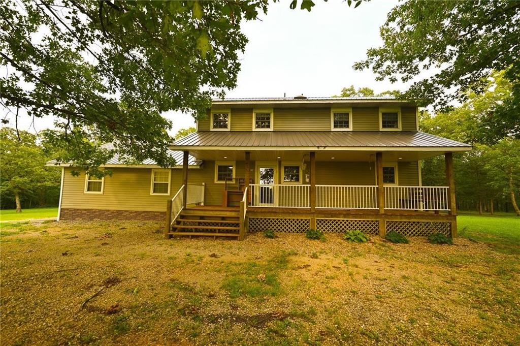 :Discover the ultimate living experience with this home near the Osage Arm of Truman Lake. This 2-bedroom, 2-bathroom house, built in 1996 Located on E Hwy North of Roscoe, this property is ideally situated just a few miles from the boat ramp and thousands of acres of public hunting grounds, making it a haven for outdoor enthusiasts. The full basement offers ample space for storage or potential for creating additional living areas to suit your needs, it does get wet in rainy times. The property also holds a shop for extra storage. Enjoy waking up to the views of nature from the large decks that accompany this home. Whether you're sipping your morning coffee or unwinding after a long day, the large decks provide the perfect vantage point for observing the abundant wildlife that frequents the area. This home is more than just a place to live; it's a lifestyle that embraces the beauty of the great outdoors. Immerse yourself in the breathtaking beauty of St. Clair County with this exceptional 121.1± acre property located west of Osceola. This land is a blend of approximately 40 acres of open fields and the rest with mature timber. The landscape is scattered white oaks, offering not only stunning scenery but also marketable timber.This property is a wildlife enthusiast's dream, teeming with deer, turkey, and rabbits that roam freely across the land. Directly behind the house, there's a park-like area where the kids can enjoy camping adventures close to home. This property is not just a piece of land; it's a place to stand on your investment. Perfect for cattle, this property features a pond that provides a water source for both livestock and wildlife. A small wet weather creek meanders through the land, creating a natural travel corridor for various species. Whether you're looking to farm, hunt, or simply enjoy the great outdoors, this land provides the perfect backdrop for your rural dreams.