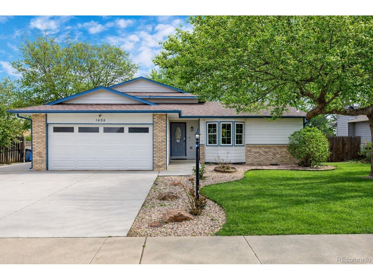 Stunning single-family home in Loveland, Colorado, ideally located just 10 minutes from Lake Loveland and 5 minutes from Bedecked Reservoir. This beautifully updated home showcases exceptional attention to detail, blending elegance with a clean, modern aesthetic throughout.Vaulted ceilings create a grand and airy atmosphere, perfectly complementing the open-concept kitchen and living space. The home features fresh interior paint, new flooring, and plush new carpet, offering a truly move-in-ready experience.The fully remodeled chef's kitchen is a standout, complete with quartz countertops, high-end appliances including a premium refrigerator, stove, and dishwasher, along with new cabinetry and a charming dry bar-perfect for entertaining. The inviting living area is anchored by a brand-new fireplace, creating a warm and cozy space to relax.The spacious primary suite offers a peaceful retreat with a bright double-sink ensuite and a walk-in closet. Two additional bedrooms and a well-appointed 3/4 bathroom provide flexibility for guests, family, or a home office.Step outside to a fully fenced backyard designed for entertaining, featuring beautiful lighting and the option to include the hot tub. An attached two-car garage and additional parking for an RV or boat complete this exceptional property.This could be your perfect place to call home-don't miss the opportunity to make it yours.