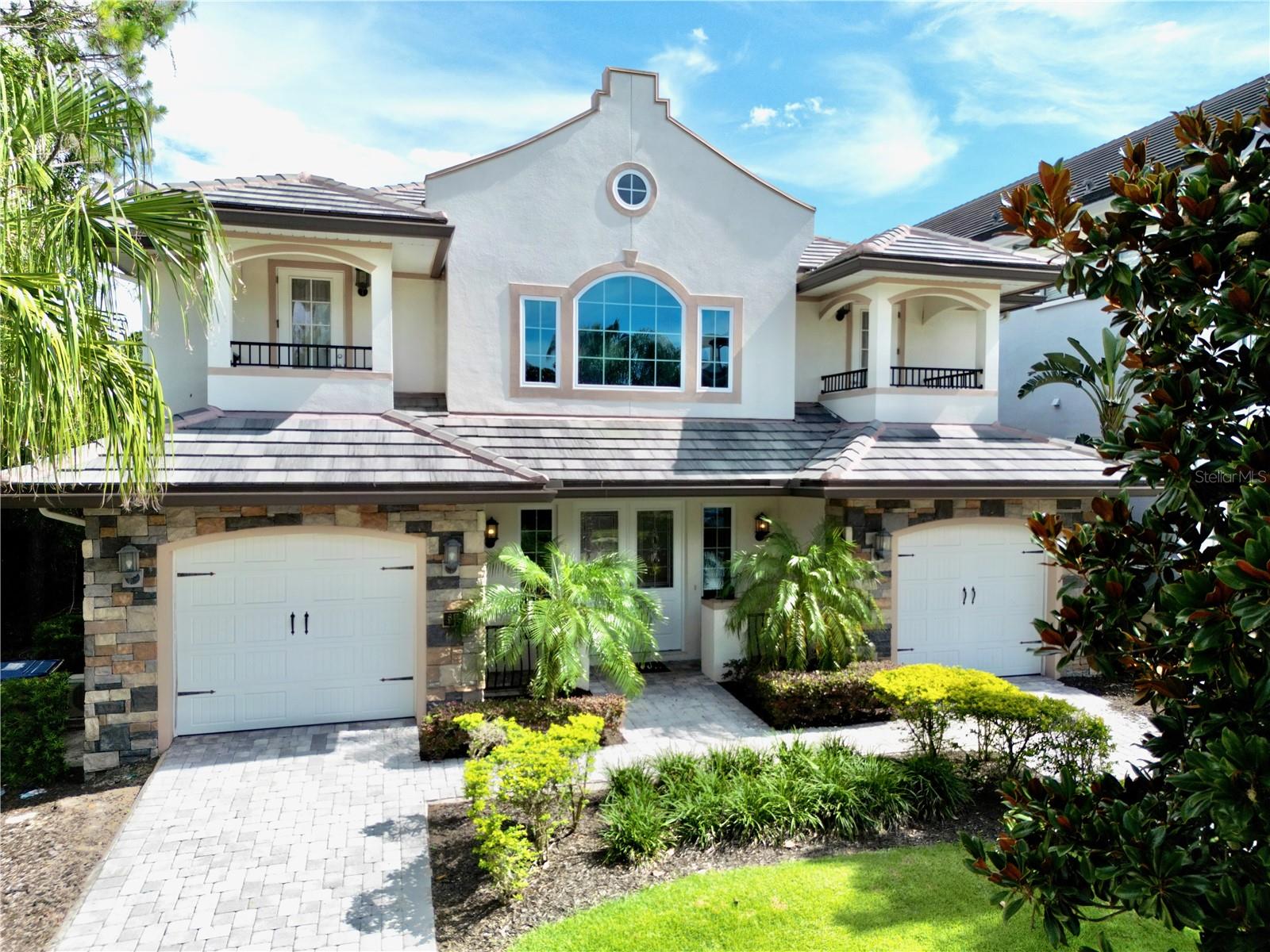 Under contract-accepting backup offers. PRICE REDUCTION – $100K OFF! ACTIVE REUNION MEMBERSHIP INCLUDED. Now offered at an incredible new price, this custom-built 5-Bedroom, 4-Bath estate in world-renowned Reunion Resort delivers over 4,100 sq. ft. of luxury living just minutes from Walt Disney World®.
Situated on an oversized ¼-acre private lot, the home boasts one of the largest screened pool and lanai enclosures in Reunion—complete with heated pool & spa, brick-built BBQ, outdoor dining for 8, and plenty of space for entertaining or relaxing. Inside, enjoy a double primary suite with Balcony overlooking pool, a private theater with reclining seats and a 100” screen, an upstairs game loft with a professional pool table, plus a second fully equipped games room with arcade racing, basketball, PlayStations, and more. This property comes fully furnished and turnkey with high-end décor, electronics, and kitchenware—ready for personal use as your primary or second home or immediate rental income. Already a proven producer, the home achieved 67% occupancy in 2024, with future 2025 bookings ready to transfer. Highlights include: Private balconies with pool & conservation views. Downstairs guest suite with en-suite bath. Active Reunion Membership (rare and valuable for access to all amenities). Three Signature Golf Courses (Palmer, Watson, Nicklaus). Water Park with lazy river & slides, Tennis, Pickleball, Fitness Center, Spa & Restaurants. This is your chance to own one of Reunion’s premier homes at a newly reduced price—don’t miss it! Schedule your private showing today. View 360 Tour at: https://www.zillow.com/view-imx/03f1763b-981c-42eb-b14e-ce5a8ca7ca7d?setAttribution=mls&wl=true&initialViewType=pano&utm_source=dashboard