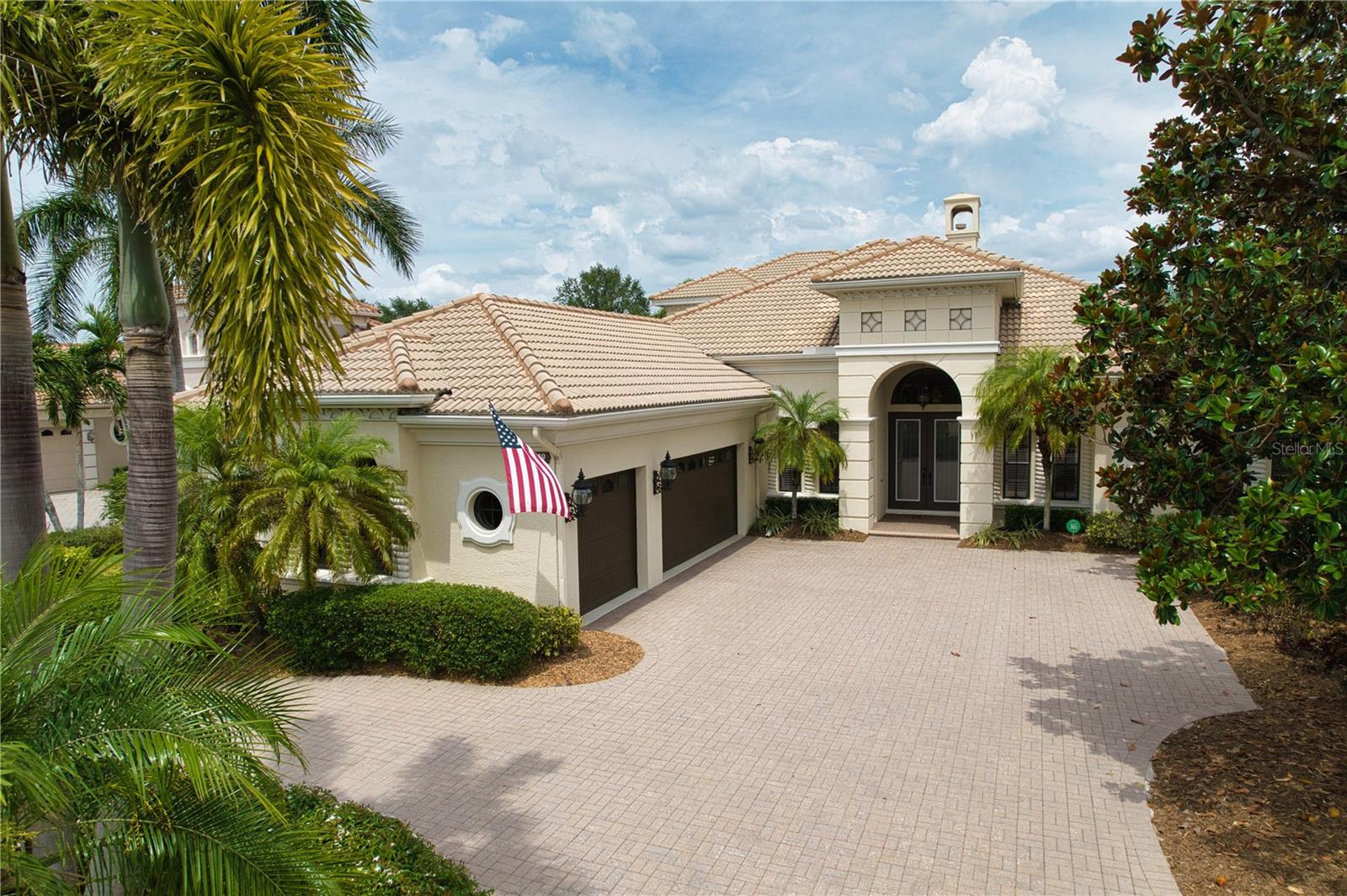 Welcome to "The Dominion" of Lakewood Ranch Country Club. 
The Dominion is one of the most exclusive and desirable neighborhoods behind the gates of Lakewood Ranch Country Club. This custom Arthur Rutenberg masterpiece – The St. Vincent II model – offers the best in Florida luxury living. Perfectly situated on a premier homesite with breathtaking views of the golf course and glistening lakes, this "like new" 5 bedroom, 4 full bath, 2 office, is move in ready and even has a spacious upstairs bonus room, private guest suite, and covered balcony that overlooks the golf course and pool.  This home provides the ideal blend of space, elegance, and function. The thoughtfully designed floor plan includes a newly updated chef’s kitchen with solid Wood Cabinetry & built-in pantry, Quartz counters, high-end appliances, and an open layout with beautiful outdoor views that flow through the Gathering Room—allowing for perfect entertaining and everyday living.
Architectural details abound: the stately exterior beckons you inside to take in the intricate crown molding, high tray ceilings and built-in features. The executive office located in the front of the home is spacious with built-in work space, cabinetry and is full of natural light.  The secondary office/flex room (with full closet) is located at the rear of the home overlooking the golf course, and sliding glass doors open onto the pool deck. High decorative ceilings throughout create a sense of timeless sophistication. The primary suite is conveniently located on the main floor in its own private wing.  With high ceilings, access to the pool and lanai area,  this suite will accommodate large estate furnishing in style. Dual walk-in closets, and a luxurious and recently updated bath with a large walk-in shower, garden tub, and private water closet with bidet, round out the primary suite.
Step outside to your private saltwater pool and spa oasis, surrounded by lovely paving brick, and unwind under the covered lanai or in the cabana with a fully equipped modern summer kitchen—perfectly designed for year-round entertaining. The circular drive, side-entry garage, and dual 220V EV charging stations add modern convenience as well as curb appeal.
RECENT UPDATES: travertine-style porcelain tile, luxury vinyl plank flooring, new countertops throughout (except office), newer appliances including dishwasher, refrigerator, oven, cooktop, and dual-function microwave, front loading washer and dryer, All 3 AC units replaced with high-efficiency filter systems, and a 24KW natural gas Generac Whole House Generator will keep everything running during power outages,  updated security system, recently refinished wood ceilings and freshly painted cabinetry (excluding office), along with an upgraded outdoor grill and hood.
Enjoy resort-style living with an optional membership to The Lakewood Ranch Country Club—offering 4 championship golf courses, 3 luxurious clubhouses, 18 Har-Tru tennis courts, pickleball, state-of-the-art fitness and aquatic centers, walking trails, and many social events. With no waitlist and optional membership, the choice is yours.
Situated near high-rated schools, premier medical facilities, parks, shopping, dining, and just minutes to Gulf Coast beaches, this property represents not just a house but a lifestyle of luxury. 
Live the dream—schedule your private showing today!
**THIS PROPERTY QUALIFIES FOR A 1% LENDER INCENTIVE IF USING PREFERRED LENDER. INQUIRE FOR MORE DETAILS.**