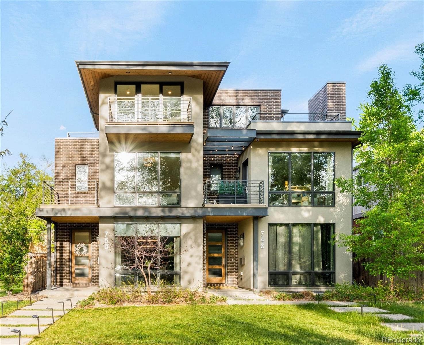 Elevated living in one of Denver’s most coveted enclaves between Hilltop and 9+CO, this exceptional custom duplex delivers four impeccably curated levels of modern luxury, crowned by a show-stopping rooftop retreat with mountain views and an outdoor fireplace. Offering 4 bedrooms and 5 baths with refined design features, quality craftsmanship, and effortless livability. The spectacular kitchen has a dramatic Quartzite waterfall island, premium Viking appliances, and custom cabinetry. A seamless open layout includes an elegant dining room and great room with a sophisticated wet bar that flows to a private backyard oasis. Upstairs features two beautiful ensuite bedrooms, including a stunning primary suite that overlooks the backyard with a custom walk-in closet and spa- like five piece bathroom + a secondary suite with its own walk-out deck and a conveniently located laundry room. The lower level defies expectations with high ceilings, abundant natural light, a spacious bedroom and bath, and a large recreation room ideal for a home theater, fitness studio, or both.The fourth level and rooftop deck serve as the exclamation point of the home. This extraordinary indoor-outdoor sanctuary features a versatile bedroom or office opening to a private west facing deck with mountain views, a beautifully appointed bar, and an expansive lounge space that transitions seamlessly to an additional deck complete with an outdoor fireplace.  Perfectly positioned in Denver’s desirable north Hilltop neighborhood, just moments from the vibrant 9+CO district and minutes to Cherry Creek North, this home sits at the center of it all - charming streets, lush parks, boutique shopping, acclaimed dining, and Trader Joes is even around the corner. This is more than a home - it’s a lifestyle defined by design, location, quality and elevated living.