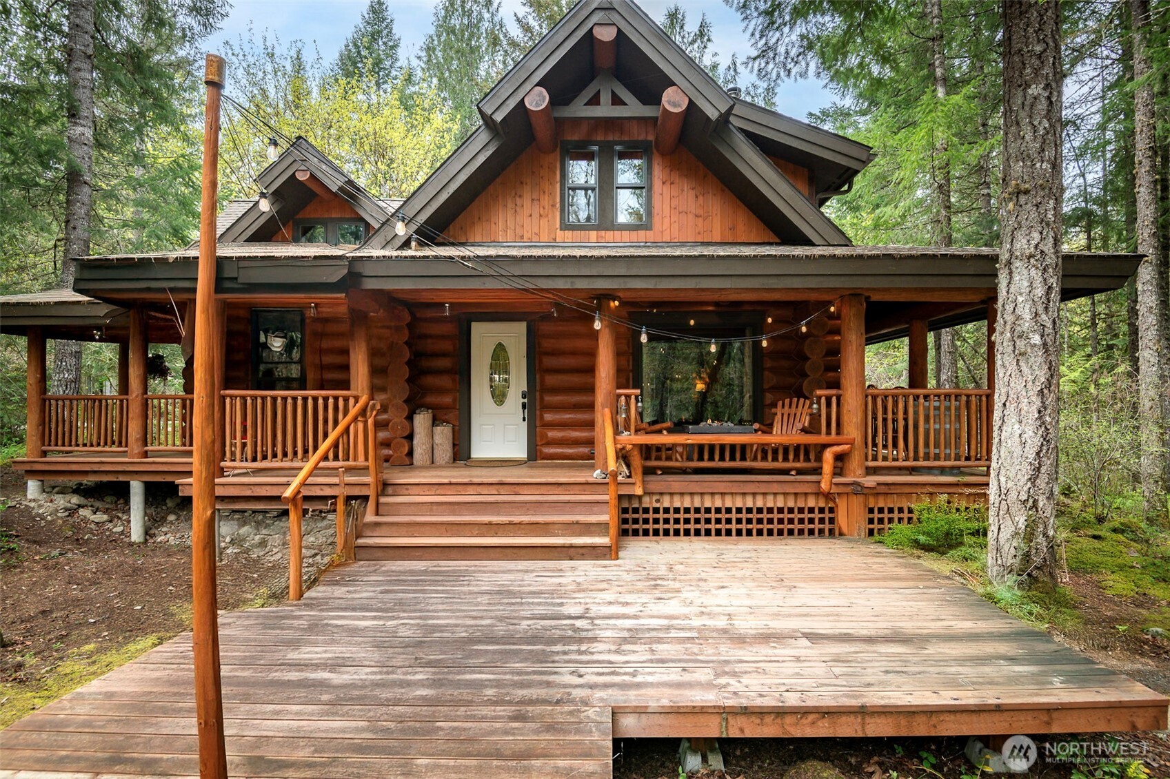 First time on the market! This stunning custom log cabin offers the perfect blend of exceptional craftsmanship, comfort, and serene creekside living. Every log was individually hand-selected, creating a truly one-of-a-kind home rich in warmth, character, and timeless appeal.Inside, you’ll discover beautiful custom features throughout, including a spacious primary suite with a private ensuite bath featuring radiant floor heat for year-round comfort. The home is served by a 3-bedroom septic system and includes a versatile loft with an additional bedroom and open living space—ideal for guests, a home office, or a cozy retreat.Step outside to the expansive wrap-around deck overlooking the peaceful creek, perfect for relaxing or entertaining while enjoying the tranquil sounds of nature. The property also features an RV hookup, is located adjacent to a park, and offers community river access, giving you even more ways to enjoy the outdoors.A rare opportunity to own a thoughtfully crafted log home in an idyllic setting—this is cabin living at its finest.