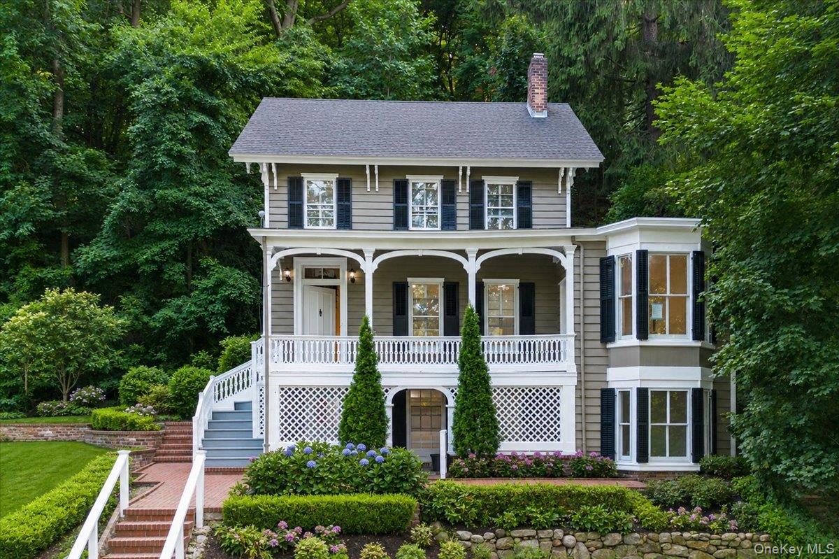 Welcome to this extraordinary and beautifully renovated Victorian landmark in the heart of Roslyn Village. Originally built in 1878, this one-of-a-kind Tuscan Villa is recognized as one of the nine historic homes featured by the Roslyn Landmark Society. Set prominently across from the breathtaking views of Gerry Park and its historic Carriage House, this distinguished residence seamlessly blends timeless architectural character with modern luxury and convenience.Offering 4 spacious bedrooms and 3 full baths, the home has been thoughtfully and extensively updated in 2026 while preserving its historic charm and elegance. Renovations include new interior and exterior painting, raised ceilings, fully updated bathrooms, a modern kitchen, new hardwood and ceramic tile flooring, completely new electrical wiring and plumbing throughout, a new HVAC system for heating and cooling, and a new Navien tankless boiler system.Original architectural details, including custom moldings and distinctive period character, complement the home's modern improvements. A walk-out basement provides additional versatile space. Water views and the picturesque park setting create a truly special backdrop for everyday living.Ideally located in the sought-after Village of Roslyn, this remarkable home is just moments from renowned restaurants, fabulous shopping, the movie theater, library, and LIRR. A rare opportunity to own a piece of Roslyn history with the comfort and quality of a completely updated 2026 residence. Mint condition and truly one of a kind.