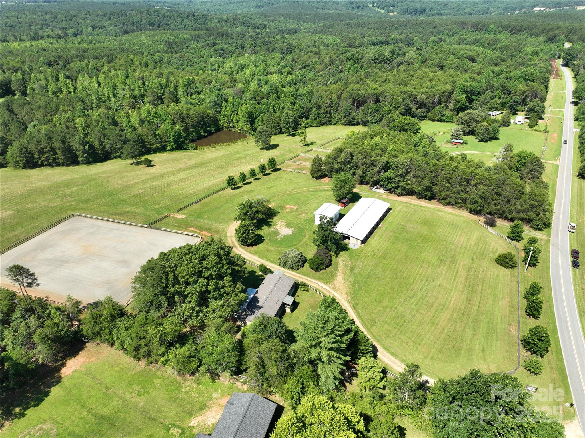 Built as an equestrian facility, this property has everything a horse professional needs.  Completely renovated 10-stall barn with tack room, office, hot/cold wash-stall, and WC/laundry. 150x200'riding arena. 5 small paddocks.  Large hay/equipment shed.
This acreage is spectacular! Areas have been left with scattered trees, a couple of wooded acres include a large pond, but most of the property is cleared to rolling fields.  Perfect to hay, establish fenced pastures, or build a riding trail or cross country course!
Exceptional quality land like this has a luxury home (and price to match)! This property is a rare opportunity with its modest but comfortable dwelling--perfect while you build your dream home or for your staff.  The front and back yards are fully fenced and dog-ready.
20 minutes to town, the property is rural AND accessible.  Just 7 miles from TIEC and Green Creek Hounds, it's the perfect base for horse boarding, training, and lay-overs in a tranquil setting.