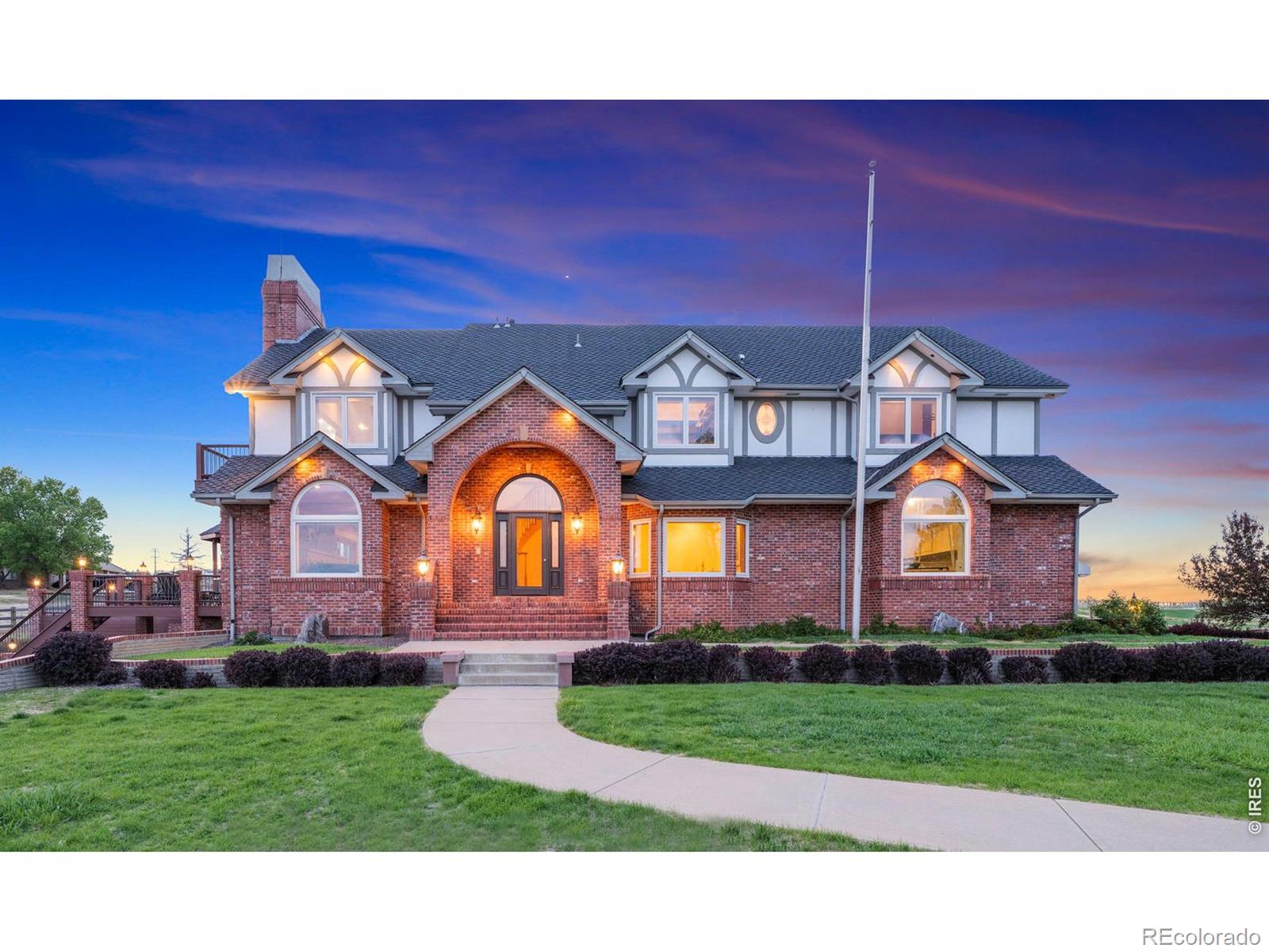 Custom home with sweeping views, privacy, and peaceful security in a gated community. Surrounded by miles of trails, open space, abundant wildlife, open plains, and distant peaks, this stately 6,169 sq ft brick estate sits on 2.2 private acres. From the soaring arched entry to the panoramic deck with octagonal gazebo, every detail reflects impressive scale and craftsmanship. The main level features a front office, great room, dining room, and a chef's kitchen with eat-in dining, Viking and Wolf appliances, and beautiful views in three directions. The great room offers a stone fireplace, a wet bar, and doors to the deck. The $220,000 investment in new Andersen Renewal windows and doors floods the home with natural light and improved efficiency. A large dining area adjacent to the kitchen provides generous space and future kitchen-expansion potential. Upstairs, the primary suite features breathtaking views, a sitting area, deck, fireplace, walk-in closet, and spa bath with soaking tub. Additional spacious bedrooms feature vaulted ceilings, and the southern-facing bedroom offers a charming window seat. The walkout lower level adds a family room with fireplace, additional bedroom, bonus room, game room and patio access-ideal for guests or flexible living. Mechanics include 2 newer AC units, Class 4 Presidential roof with 50-year transferable warranty, 1 new air handler , 2 new water heaters, Culligan water softener system and Reverse Osmosis water system, new security system, and updated septic. Views, space, privacy and peace of mind-all in one remarkable property.