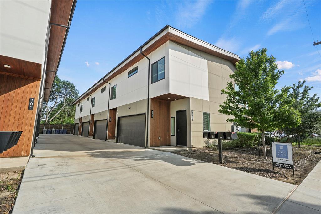View of home's exterior with concrete driveway and an attached garage