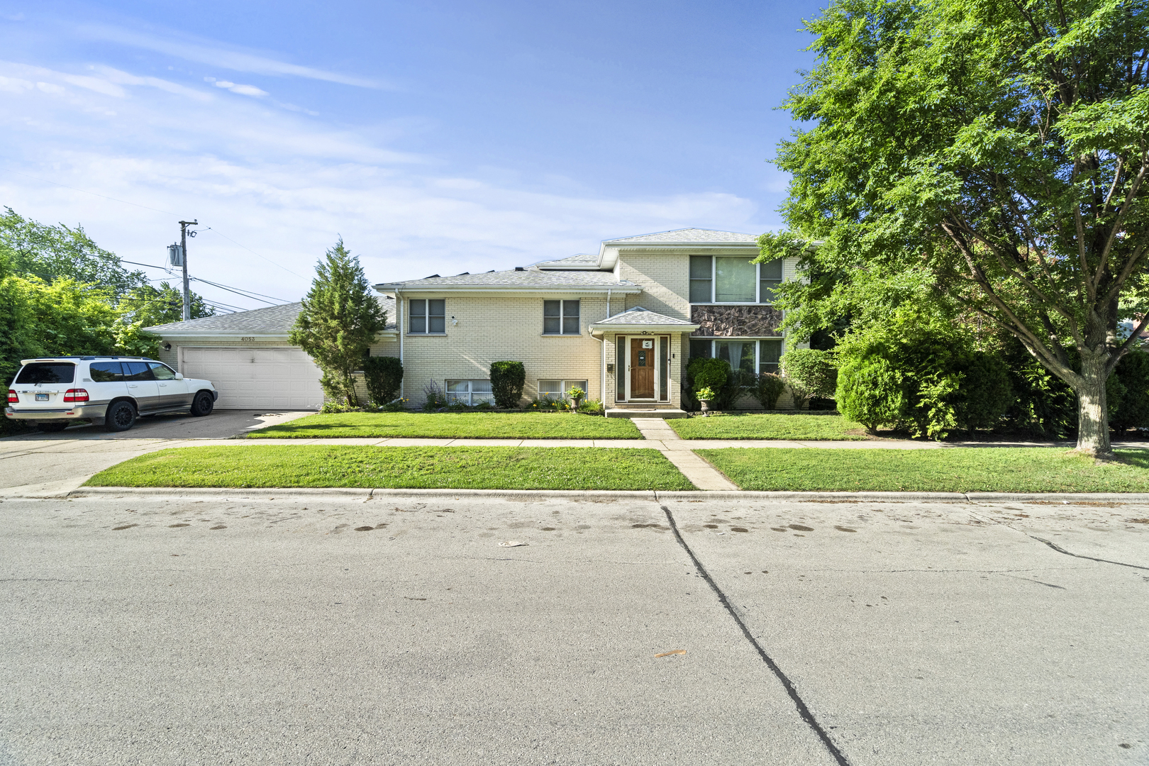 FRESHLY PAINTED!! This rare 4-level split in Skokie is not your basic single-family home-it's a full-on lifestyle upgrade with an open concept 5 bedrooms, 3.5 baths, 2 full kitchens, kitchen island, a massive office (perfect for WFH or your side hustle), sub-zero refrigerator and an oversized 2.5-car garage with serious storage. From the sleek maple cabinets, Corian countertops, and hardwood floors to the paid-off solar panels, this corner-lot stunner is serving space and savings. The huge yard is decked out with fruit trees, grape vines, and a patio made for chill weekends or epic hangouts. Whether you're hosting fam, running a biz, or renting out a level, this home flexes with your lifestyle-and it's just minutes from schools and public transit. If you're craving something bold, flexible, and totally unbasic-this is the one.