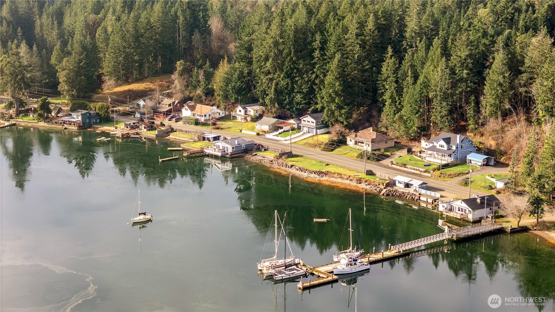 Imagine the possibilities at this waterfront home in Belfair, where daily life is shaped by the water and the surrounding natural beauty. On the shore of the Southern bend of the Hood Canal, make waves and memories at 4710 NE North Shore Road. With four bedrooms, a detached garage, open living spaces, and basement, abundant opportunities await. This home offers a flexible footprint, ready to support your vision. Just steps from nearby residential docks, mornings begin with calm waters and days filled with boating, kayaking, and year-round recreation. This home on the peaceful waterfront setting surrounded by outdoor adventure, combined with strong usability and income potential, creates a compelling opportunity for both lifestyle buyers and investors in a sought-after location. Only 1.5 miles from Belfair State Park!