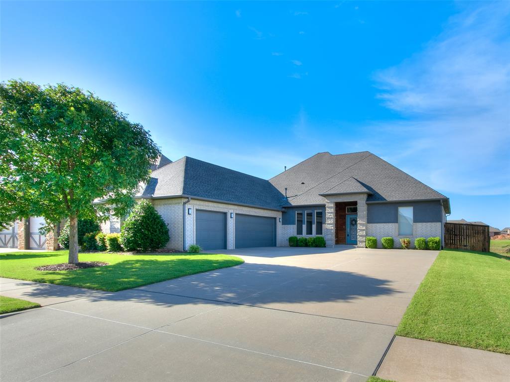 Welcome home to this beautifully maintained one-owner modern home situated on a premium corner lot with the neighborhood pond bordering two sides, offering stunning water views from the living room, kitchen, and dining area. Located in the highly desirable gated Windstone neighborhood, residents enjoy access to a clubhouse, pool, basketball court, and playground.  Inside, you'll find an inviting entry, spacious office, and an open living area featuring functional built-ins, a modern fireplace, and large windows that fill the home with natural light. The chef's kitchen is designed to impress with high-end appliances, a massive quartz-topped island, beautiful cabinetry, a built-in pantry with sliding drawers, and an additional walk-in pantry.  The spacious primary suite offers a spa-like bathroom with a soaking tub, shower tower with multiple sprayers, heated towel rack, and a large custom closet with built-ins. Additional features include modern fixtures throughout, a well-appointed laundry room with dual countertops, abundant cabinetry, a built-in mud bench, and a storm shelter in the garage.  This exceptional home combines luxury, functionality, and beautiful views in one of the area's most sought-after communities.
