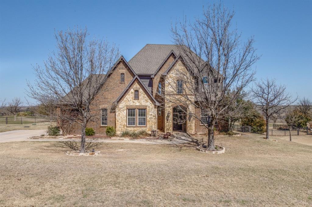 Welcome to this stunning 4-bedroom, 3.5-bathroom home, perfectly nestled on over 1.2 acres of land. Designed with both elegance and functionality in mind, this home provides ample space for relaxation, entertaining, and everyday living. As you step inside, you are greeted by a beautifully designed open-concept living area, where high ceilings and abundant natural light create a bright and inviting atmosphere. A cozy fireplace serves as the focal point, offering warmth and charm for family gatherings or quiet evenings at home. The chef’s kitchen is a true showstopper, featuring a large island, extensive counter space, and modern appliances that make cooking and entertaining effortless. With plenty of cabinet storage and a walk-in pantry, this kitchen is both stylish and highly functional. For those who work from home or need a quiet space, a dedicated home office provides the perfect retreat. Whether you use it for business, studying, or a personal library, this space adds versatility to the home. The primary suite is nothing short of luxurious, offering a private escape with a spacious layout, dual vanities, and a walk-in closet. The spa-like en-suite bathroom is complete with a garden, jetted tub, providing the perfect place to unwind after a long day. Upstairs, a large game room awaits, offering endless possibilities—whether you envision it as a media room, play area, or entertainment space, it’s designed to fit your needs. A two-car garage, along with a separate one-car garage next to it, offers ample space for vehicles, storage, and even a workshop for hobbies or projects.