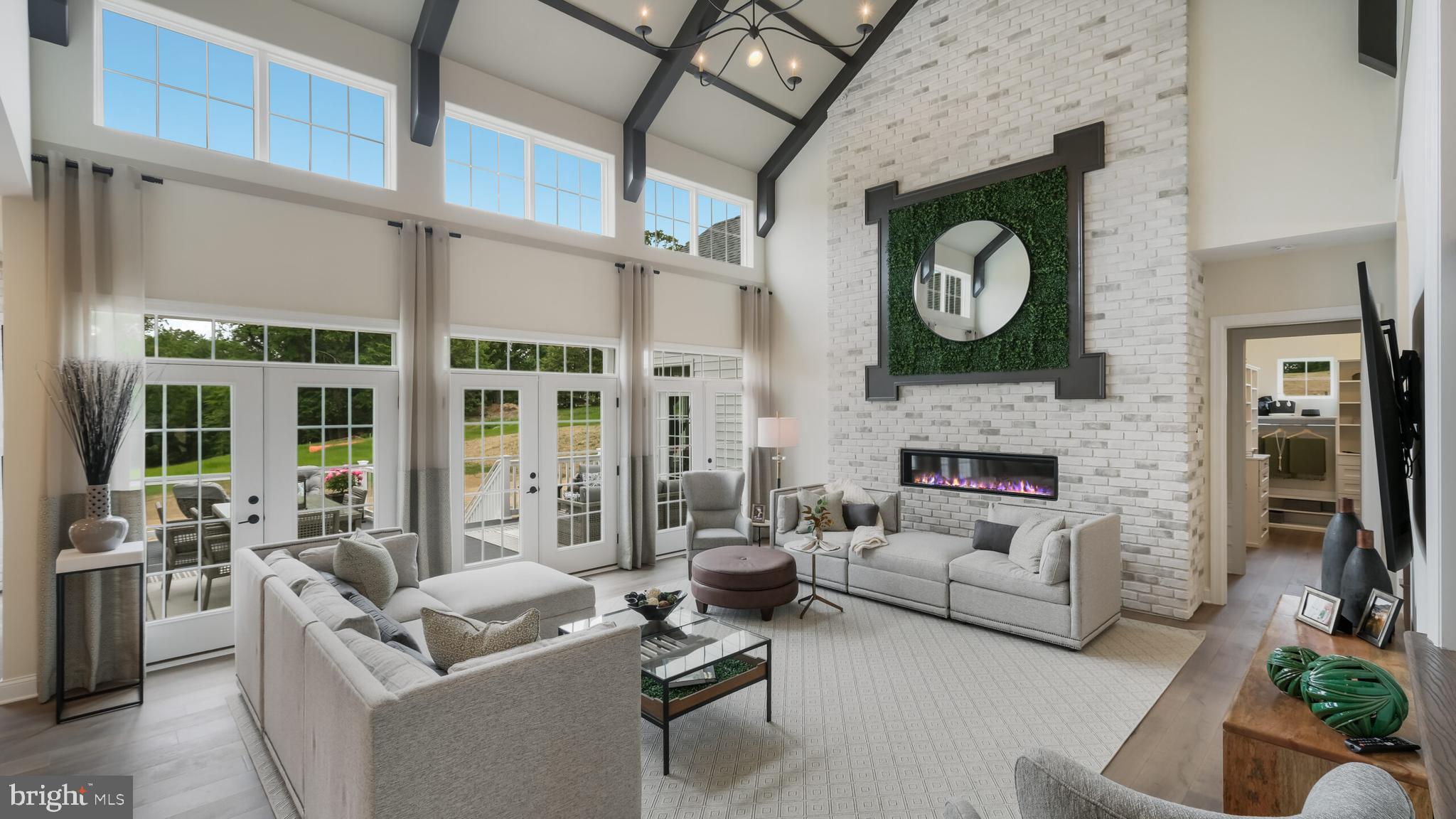 Elevated luxury awaits at The Estates at Stonecliff by Foxlane Homes, an exclusive Glenmoore enclave of 36 estate homes offering the only new construction estate homes on expansive homesites within the prestigious Downingtown Area School District. Set among Chester County’s rolling hills, this exceptional community blends timeless architecture with refined semi-custom craftsmanship. At the heart of The Oxford floorplan is a luxurious primary suite conveniently located on the main level—offering privacy, comfort, and effortless accessibility. The spacious bedroom feels like a true retreat, complemented by a spa-inspired bath and generous walk-in closet space. Positioned just steps from the main living areas, it creates a layout that balances connection and quiet, delivering everyday ease without sacrificing elegance. The main living space is equally impressive, anchored by a grand, two-story great room that flows seamlessly into an open-concept kitchen designed for both daily living and memorable gatherings. The Oxford is uniquely suited for families who want space to gather—and space to retreat. Whether hosting extended family, welcoming adult children home, or accommodating long-term guests, a spacious second level with two en suite bedrooms and a central loft allows everyone to enjoy comfort and privacy while remaining beautifully connected. Thoughtfully designed with space, flow, and comfort in mind, the Oxford floorplan offers wide-open living areas, seamless indoor-outdoor connection, and a private first-floor owner’s suite that makes every day feel like a retreat.Foxlane’s semi-custom approach offers exceptional opportunities for personalization, including finished lower levels, bluestone porches, designer cabinetry, premium finishes, and curated details tailored to your lifestyle. Our design team is here to meet with you and make your vision come to life in the house of your dreams. Photos are for representative purposes only. Pricing subject to change. See Sales Representative for details.