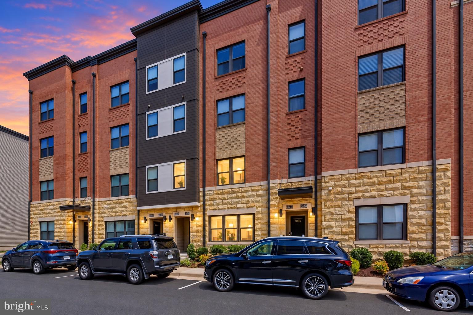 COMING SOON! Immaculate two-level, townhome-style condo in the heart of highly sought-after One Loudoun! This beautifully maintained 3BR, 2.5BA home offers an exceptional blend of style, comfort, and convenience, 9-foot ceilings, a private balcony, and a one-car garage with additional storage plus driveway parking.The main level features a bright, open-concept layout with upgraded luxury laminate flooring and a modern gourmet kitchen with stainless steel appliances, granite countertops, stylish backsplash, and hard-wired under-cabinet lighting. Upstairs, the spacious primary suite offers two walk-in closets and a beautifully appointed bath with an extra-wide vanity, large walk-in shower with built-in bench, and separate water closet. Two additional bedrooms provide flexibility for guests, a home office, or additional living space, with one offering direct access to the private balcony. Upper-level laundry adds everyday convenience.Enjoy an incredible One Loudoun lifestyle with access to resort-style amenities including an outdoor pool, kiddie splash area, indoor basketball court, tennis, beach volleyball, gated dog park, playgrounds, party and meeting spaces, and more. Nearby, enjoy The Barn, One Central Park, walking paths, and green space throughout the community.Best of all, enjoy the walkable One Loudoun lifestyle with an impressive mix of restaurants, bars, coffee shops, boutiques, Trader Joe’s, Barnes & Noble, Sephora, fitness and wellness offerings, Alamo Drafthouse, and the vibrant Downtown Plaza. Conveniently located near Route 7, Route 28, the Dulles Toll Road, and Dulles International Airport, this is a rare opportunity to enjoy space, convenience, and an exceptional lifestyle in one of Loudoun County’s most sought-after communities. Sophisticated, convenient, and truly walkable, this is One Loudoun living at its best!