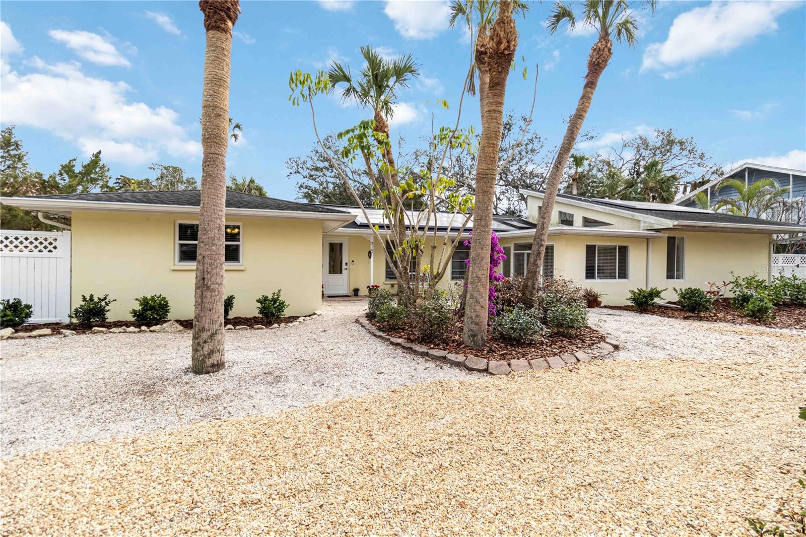 One or more photo(s) has been virtually staged. Welcome to this beautifully renovated ranch-style home, ideally located within minutes to the #1 beach in the United States—Siesta Key Beach! Set on an oversized lot, this property offers a private outdoor oasis with a relaxing pool surrounded by lush, mature landscaping, perfect for entertaining or unwinding after a day at the beach. Designed for effortless single-level living, this home blends modern updates with timeless coastal style, making it perfect as a full-time residence, vacation getaway, or investment opportunity. Offering 3 spacious bedrooms + den and 2.5 updated baths, the thoughtfully designed floor plan delivers both comfort and functionality. Light-filled living areas flow seamlessly throughout the home, complemented by a stylishly updated kitchen and baths featuring quality finishes. A detached garage adds valuable convenience and storage. Recent upgrades include a 2024 Tesla solar system with two Powerwall's, providing energy efficiency, backup power, and long-term savings. Additional improvements include two HVAC systems for optimal climate control and a new water heater for added peace of mind. Enjoy morning strolls to the world-renowned quartz sands of Siesta Key Beach, evenings dining at Siesta Village, and the ease of move-in-ready coastal living in one of the most sought-after locations.