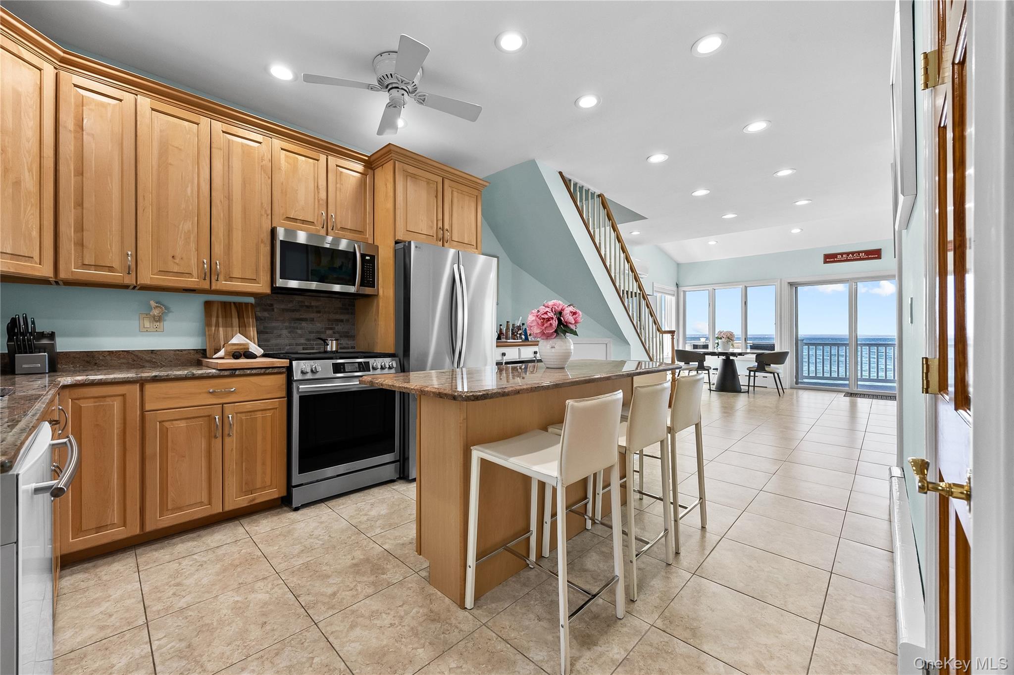 Experience the ultimate waterfront lifestyle in this beautifully updated coastal retreat, perfectly positioned directly on the beach in the charming village of Bayville. This exceptional home offers breathtaking, unobstructed water views from multiple levels, creating a serene and luxurious living experience.The sun-filled main level features an open-concept layout with a spacious living and dining area, enhanced by oversized windows and sliding glass doors that lead to a stunning beachfront deck—ideal for entertaining or simply enjoying the sound of the waves. The modern kitchen is equipped with granite countertops, stainless steel appliances, and a large center island, seamlessly blending style and functionality.This well-appointed home offers 2 spacious bedrooms and 2 full bathrooms, thoughtfully designed for both comfort and privacy. The expansive primary suite is a true sanctuary, featuring soaring ceilings, abundant natural light, and panoramic water views. Step out onto your private balcony to enjoy morning coffee or evening sunsets over the water.Additional highlights include in-unit washer and dryer, updated bathrooms, and multiple outdoor living spaces, including two levels of decks overlooking the beach—perfect for relaxation and gatherings. With direct beach access, you can enjoy waterfront living at its finest year-round.Located just moments from local shops, dining, and parks, this rare beachfront property combines tranquility with convenience.A true coastal gem—don’t miss this unique opportunity to own your own piece of paradise.