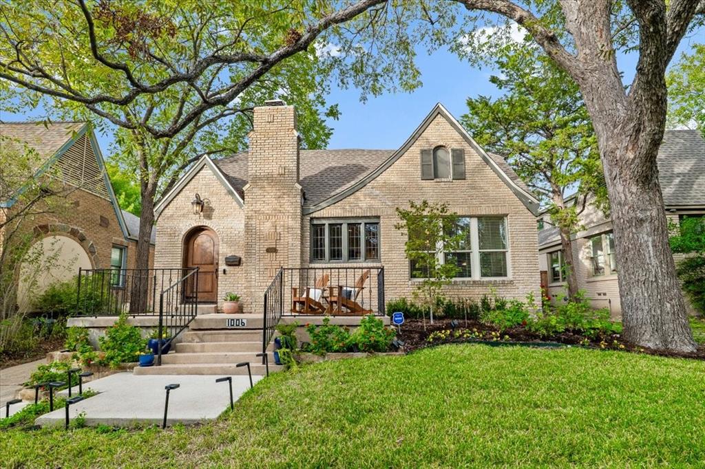 Storybook style meets an exceptional East Dallas location at 1006 Cordova in the heart of Hollywood–Santa Monica and the highly sought-after Lakewood Elementary attendance area. Set on an elevated lot, this stylish, updated Tudor welcomes you with striking curb appeal and a generous front porch. Hardwood floors throughout, crown moldings, leaded glass accents, and a gas-log fireplace showcase the neighborhood’s signature period charm, complemented by recessed lighting and updated windows. Walls of windows fill the home with natural light, highlighting the spacious living and dining rooms. A second living area with French doors provides flexibility for a home office, playroom, or third bedroom. Custom kitchen cabinetry offers an abundance of storage, while recently added custom steel doors provide direct access to the oversized covered patio—an exceptional setting for entertaining overlooking the landscaped backyard with a recently added sprinkler system and an additional storage shed. The primary suite features a private bath, walk-in closet, and custom built-in storage cabinet. Secondary bedroom features a walk in closet and direct access to the second front living area. A central hall bath completes the home. Enjoy a beloved neighborhood known for its distinctive architecture and community spirit, close to the Santa Fe Trail, White Rock Lake, Tenison Park Golf Course, and Lakewood shopping and dining, with convenient access to the Baylor Medical District and downtown Dallas.