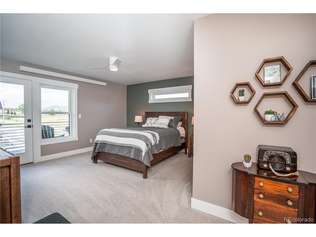 Situated on a beautifully landscaped corner lot, this thoughtfully designed 2022-built home offers 3 beds, 4 baths, and 2,048 SQFT of modern living with exceptional mountain views, flexible living spaces, and quality finishes throughout. Begin your mornings on the welcoming front porch or unwind on the private balcony off the primary suite, where breathtaking unobstructed views of S Mountain and the peaceful pasture across the street create a truly special setting. Inside, the open-concept living room flows seamlessly into the beautifully appointed kitchen showcasing quartz countertops, designer tile backsplash, and an oversized walk-in pantry. The spacious dining area connects to a cozy family or movie room, while brick accent walls add warmth and timeless character throughout the home. The main level offers a half bath and dedicated laundry/mudroom with direct backyard access. Upstairs, a versatile loft space and full bath works as a home office or flex space. Two generously sized secondary bedrooms provide ample closet space, including one with a private ensuite. The spacious primary suite is a true retreat with a private balcony, dual vanities, a private water closet, and an oversized walk-in closet. Designed for both relaxation and entertaining, the fully fenced backyard features low-maintenance turf, overhead cafe lighting, exterior water spigots for gardening, and a private setting with beautiful mountain views. The detached, fully insulated two-car garage features an EV charger, reclaimed wood walls, overhead LED lighting, an expansive workbench and attic storage with ladder access. Additional parking is available alongside the garage. Enjoy nearby community green space with guest parking and an open grassy area perfect for pets and gathering with neighbors. With multiple ensuite bedrooms and flexible living spaces, this home also offers excellent potential for multigenerational living or rental opportunity. Your move-in-ready mountain home awaits!
