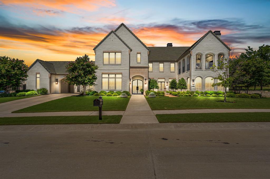 This exceptional home sits on a gorgeous half acre lot and offers a thoughtfully designed floor plan. It features 5 bedrooms with en suite baths, 2 half baths. Multiple living areas include a cozy family room with fireplace, a downstairs media room and an upstairs bonus room that opens to a covered patio with a view. 4 living areas.  Designed for entertaining the home includes a stunning kitchen with a large island, dual dishwashers, marble countertops and a custom hood. The backyard is a true retreat, with an outdoor kitchen, pool, hot tub, covered patio with motorized screens, and a wood-burning fireplace. Additional highlights include a dedicated home office and separate - homebase space - with built-ins and exceptional storage. There are two laundry rooms, one on each level. Originally one of Fort Worth Magazine's 2022 Dream Street homes, it also features a chilled wine room, two-story, great room, outdoor courtyard with fountain, and professionally designed finishes from custom, drapery and designer lighting to beautiful hardwoods, wallpapers and tile. Don't miss this one of a kind opportunity