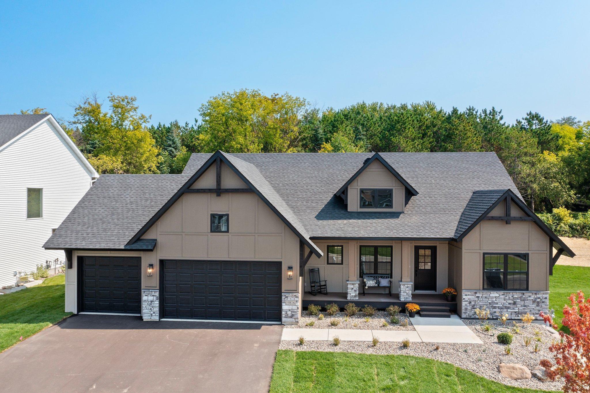 Welcome to Stone Cottages 'Mahogany' floor plan. Large picture windows flood tons of natural light through the home. The main level presents a wonderful open floor concept with elegant manufactured hardwood flooring, offering a blend of durability and timeless beauty. The great room showcases a cozy gas fireplace and an amazing vaulted ceiling. Adjacent is the dining room with views to the backyard. Bright and functional kitchen featuring ample cabinetry, generous counter space, and a convenient layout perfect for everyday living and entertaining. Primary bedroom with ensuite and large walk in closet, office/bedroom, laundry room and 3/4 bathroom complete the main level. The lower level walk out features three generously sized bedrooms with large windows that bathe the rooms in natural light as well as a family room with a spacious layout. The 5th bedroom is a versatile space designed to be used as a bedroom or recreation room to meet all your needs.