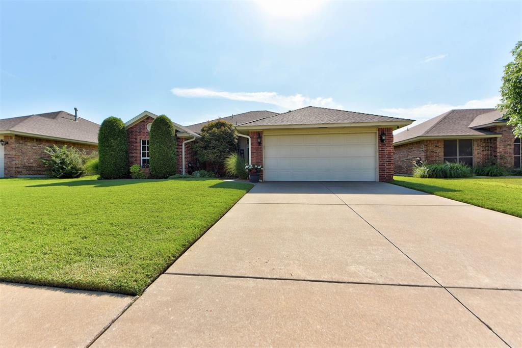 Welcome to your new family home in the Moore School District! This 3-bed, 2-bath gem features durable floating wood laminate flooring throughout—perfect for busy kiddos and pets. The heart of the home is a bright, open living room with a cozy wood-burning fireplace, ideal for family gatherings and movie nights. Enjoy a fully equipped kitchen with stainless steel appliances, combining style and durability for everyday meals and entertaining. A smart split floor plan puts the master suite on its own side of the house, offering peace and privacy. The master suite includes two walk-in closets and a bath with a separate shower and soaking tub. 
Added peace of mind comes from the FlatSafe in-garage storm shelter, built to FEMA standards with a low-profile steel lid and concrete encasement. Out back, a spacious yard and large firepit area await—perfect for s’mores evenings, birthday parties, or relaxing under the stars. A perfect blend of safety, style, and family-friendly features—schedule your tour today!