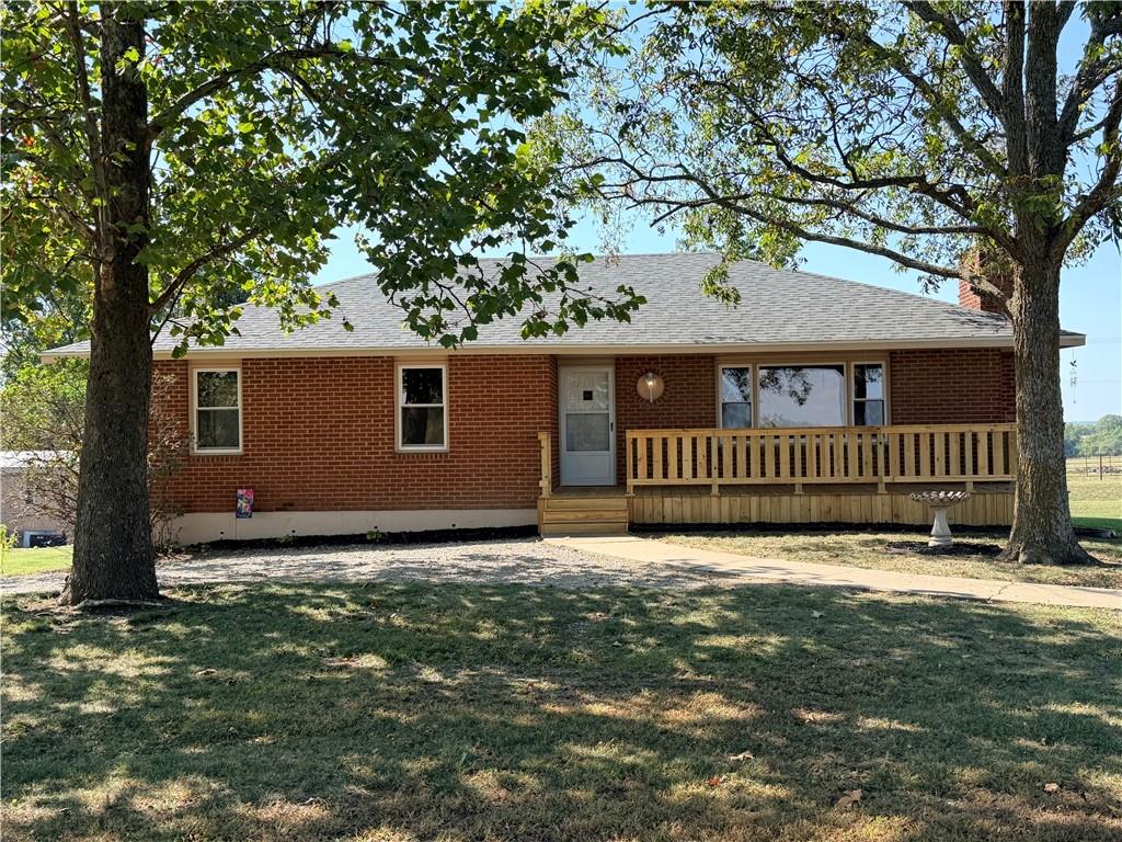 You don't want to miss this 3 bedroom 2 bath home on 3 acres...just off the blacktop! Lots of updates throughout including new interior and exterior paint, flooring, vinyl thermal windows, front & back deck and more. The LR features a fire place with a large picture window to let in natural light, the dining room is off the kitchen. Down the hall are the 3 bedrooms and a full bathroom. The second full bathroom is off the master bedroom with access also from the dining room.  The unfinished basement is ready to be finished & features a fireplace. There is also a non conforming potential bedroom with closet and kitchenette, plus a possible 3rd bathroom. Newer HVAC and hot water heater. There is an abundance of pecan trees. This property is known as Dunlap corner and has been the location of a very successful fireworks stand for many many years, plus 2 other successful businesses prior to that. Several outbuildings. The east building was the fireworks stand, the roof is newer, the warehouse 30x50 has doors on the N & S, the attached showroom has a wall AC unit. There is a 13' wide lean to on the East and a 16' on the West. The SE shop was the steel shop, it has a man cave room with wall AC unit, the shop also has a water hydrant and furnace, it does need a gas line.  There is an attached office w/ storage room plus another 19' lean to on the South side. On the SW bldg 60x80, the north half has wide doors on the E & W for easy pull thru, office in the middle, another large enclosed section on the SW. The SE section is open 37x36 with gravel floors. (please verify all measurements, these are approximate)