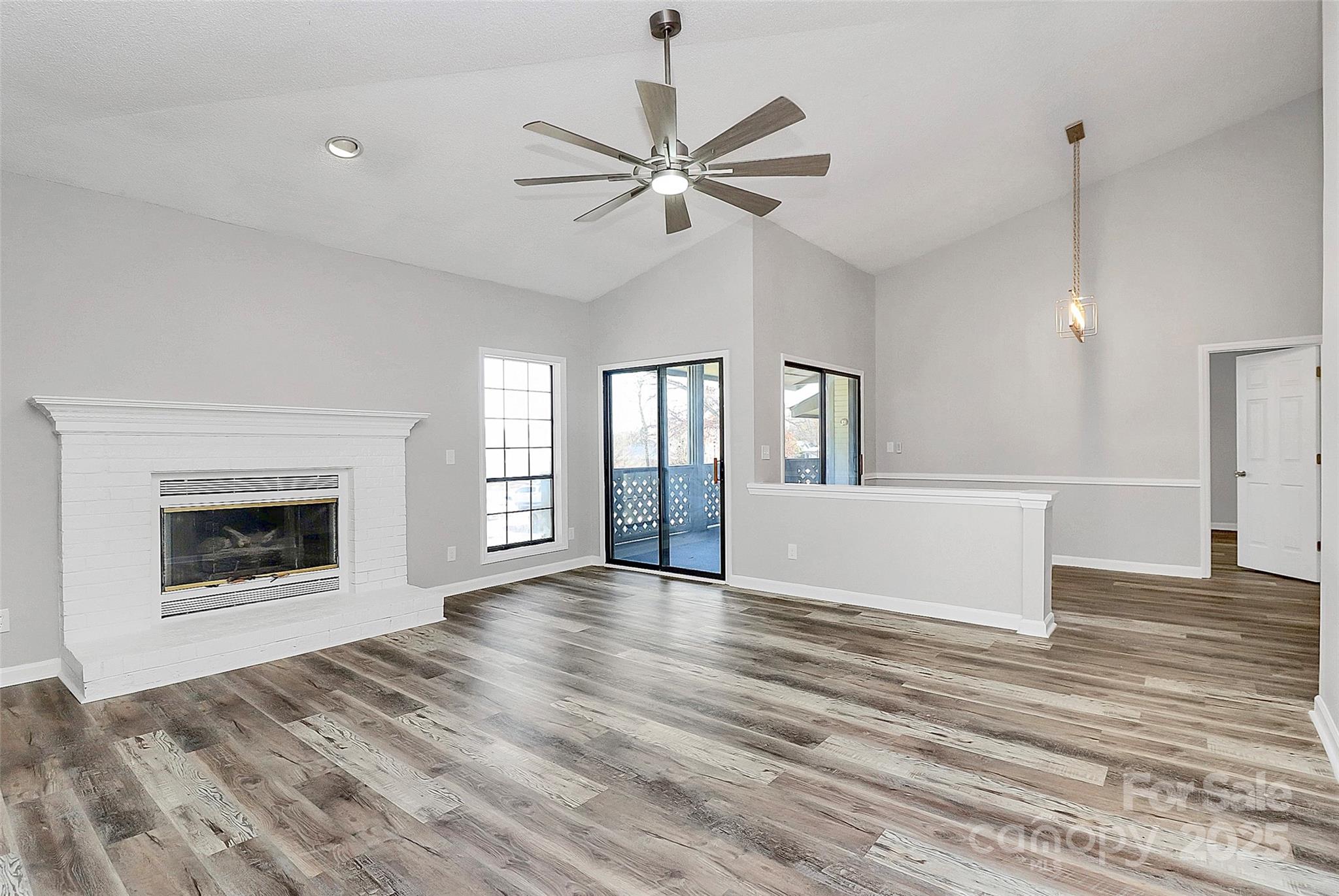 Amazing Renovation on this 2 Bed, 2 Bath End-Unit Condo in the Harris Lake Community! This must see condo boasts fresh paint throughout with new vinyl laminate flooring in Master & living areas, new fans in living room and both bedrooms.  New chandelier in dining room & lighting in kitchen, new electric outlets, & countless Modern upgrades. New door knobs, new carpet in secondary bedroom. Kitchen has been upgraded with granite, subway tile backsplash, Brushed nickel knobs, trash disposal, new faucet, & new SS appliance package including a wine beverage cooler. Guest bath updated with new tile to ceiling, new toilet, new vanity, new lighting, mirror, & laminate flooring. Custom master bath features new tile w/niche, spacious Garden tub, new toilet, vanity light, and bathroom hardware. Ample storage on balcony, tucked away in the back of the neighborhood for privacy. Great location close to Uptown, Airport, Plaza Midwood, NoDa. HOA just replaced roofs & building exteriors. No rental caps but (Air BnB) is not allowed. Spacious layout with large bedrooms. Brick fireplace in living room. Open the drapes in the morning and enjoy the light through the generous sized windows and sliding doors to the deck.