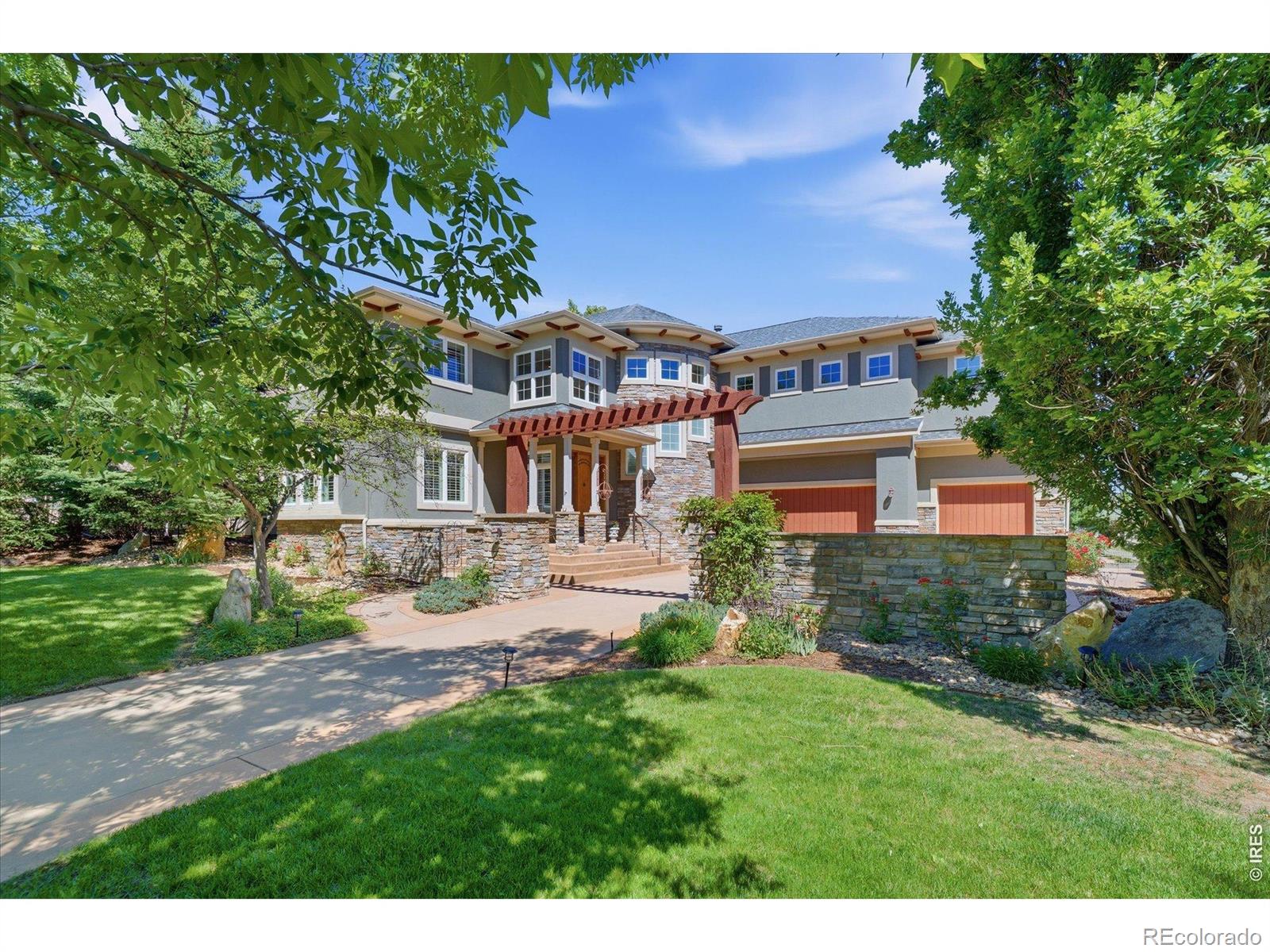 Perfectly positioned along the 4th fairway of the renowned Indian Peaks Golf Course, this exceptional custom home offers refined living space on a beautifully landscaped lot with sweeping golf course & mountain views. Dramatic 2-story entry & living room showcase walls of windows that fill the home with natural light while framing the spectacular setting beyond. 6 bedrooms, 6 baths. Primary suite w/ an amazing home office + 3 secondary beds upstairs, additional main level living suite and large bedroom / full bath and gym on lower level. Professional grade kitchen with huge center island and butler's pantry. Indoor and outdoor living blend seamlessly making this home ideal for entertaining