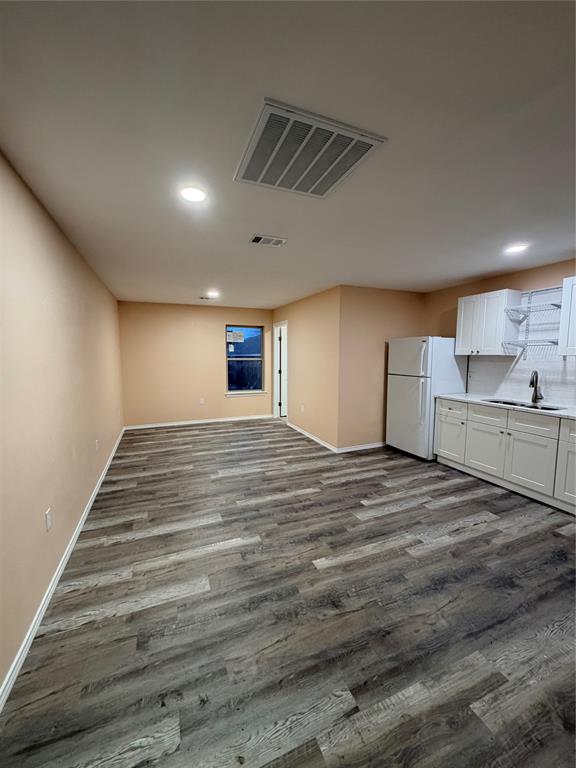 This beautifully designed Accessory Dwelling Unit (ADU) is privately situated behind the primary residence, offering a quiet and comfortable living space with convenient shared driveway access alongside the main home.  This brand-new unit features 1 spacious bedroom and 1 full bathroom, thoughtfully laid out to maximize comfort and functionality. The fully equipped kitchen includes a refrigerator, microwave, and electric stove, along with ample cabinetry and counter space. There is plenty of room to accommodate both a cozy breakfast nook and a comfortable living area, creating an open and inviting atmosphere perfect for relaxing or entertaining. Located just 15 minutes from downtown Dallas and the vibrant Bishop Arts District, this home offers convenient access to shopping, dining, entertainment, and major highways while maintaining a peaceful residential setting.Ideal for individuals or couples seeking modern living with easy access to the heart of the city, this ADU blends privacy, convenience, and contemporary comfort.