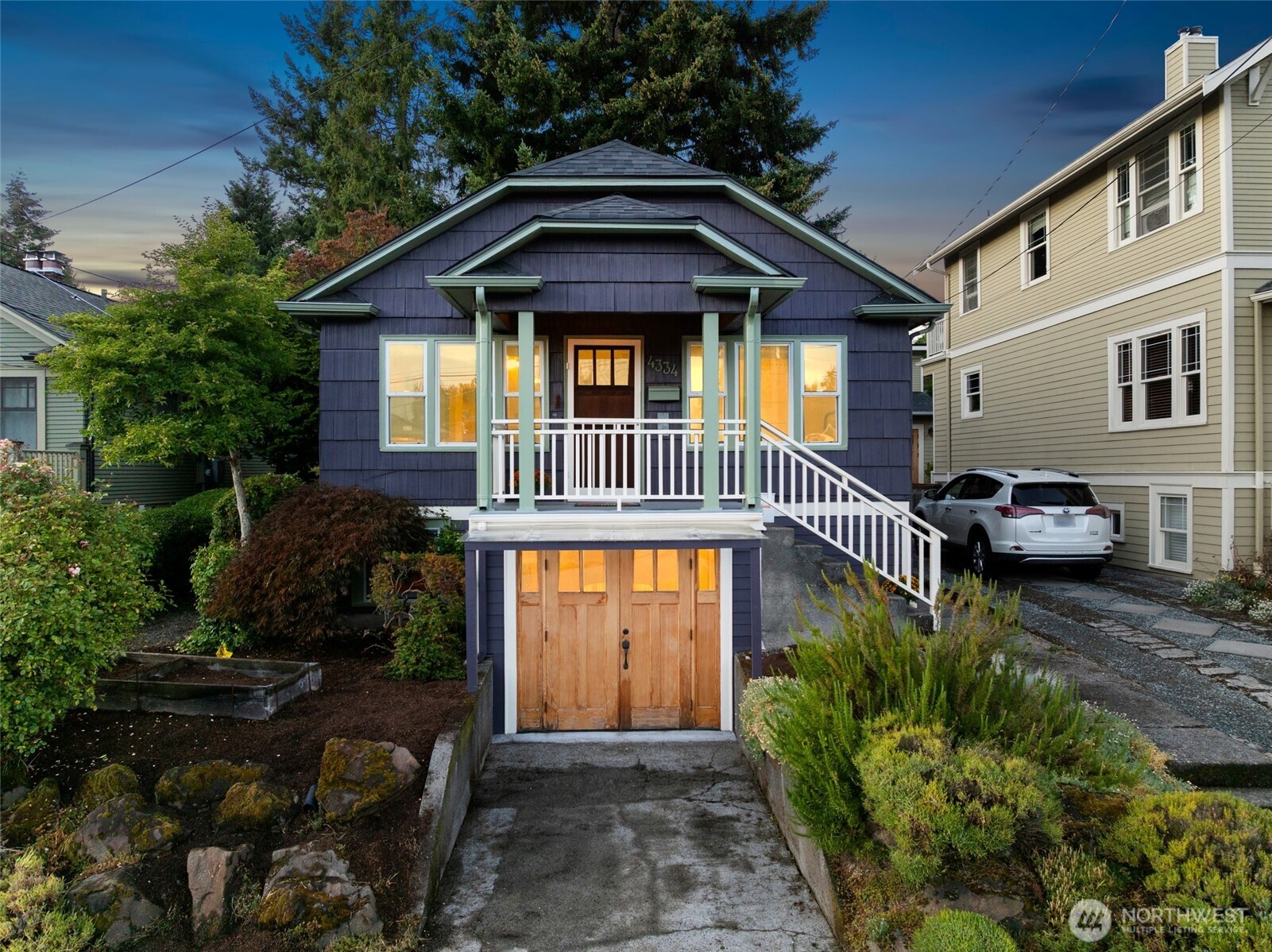 You’ll feel instantly wrapped in warmth and West Seattle magic the moment you step into this Seaview craftsman, where timeless architecture meets elevated comfort. Sunlight pours across rich hardwood floors in the inviting living room, dancing around the classic fireplace and westerly windows that frame nightly sunset shows. The kitchen offers everyday ease and connects directly outside to spacious deck and patio. The primary suite delivers a spa-like escape with a beautifully tiled shower and generous walk-in closet. Step outside and your lifestyle expands. An exceptional deck becomes your personal retreat for morning coffee, golden-hour lounging, or lively summer dinners. The fenced south-facing yard is a gardener’s playground—terraced and ready for everything from growing berries to the future DADU of your dreams. And tucked into the garden is a delightful 100 sq ft studio, perfect for a home office, art haven, yoga retreat, or simply a place to hide from your to-do list. All of this sits in a quiet pocket of Seaview, just moments from the vibrant energy of Alaska Junction—coffee shops, restaurants, boutiques, and community charm. You will love the short stroll to Uptown Espresso, Bakery Nouveau, Portage Bay Cafe, West Seattle Nursery and more. Major upgrades including a 2025 new roof, double-paned windows, new electrical, earthquake retrofit, updated furnace & AC for cooling ensure peace of mind. A rare home blends charm & convenience, and the best of West Seattle living.