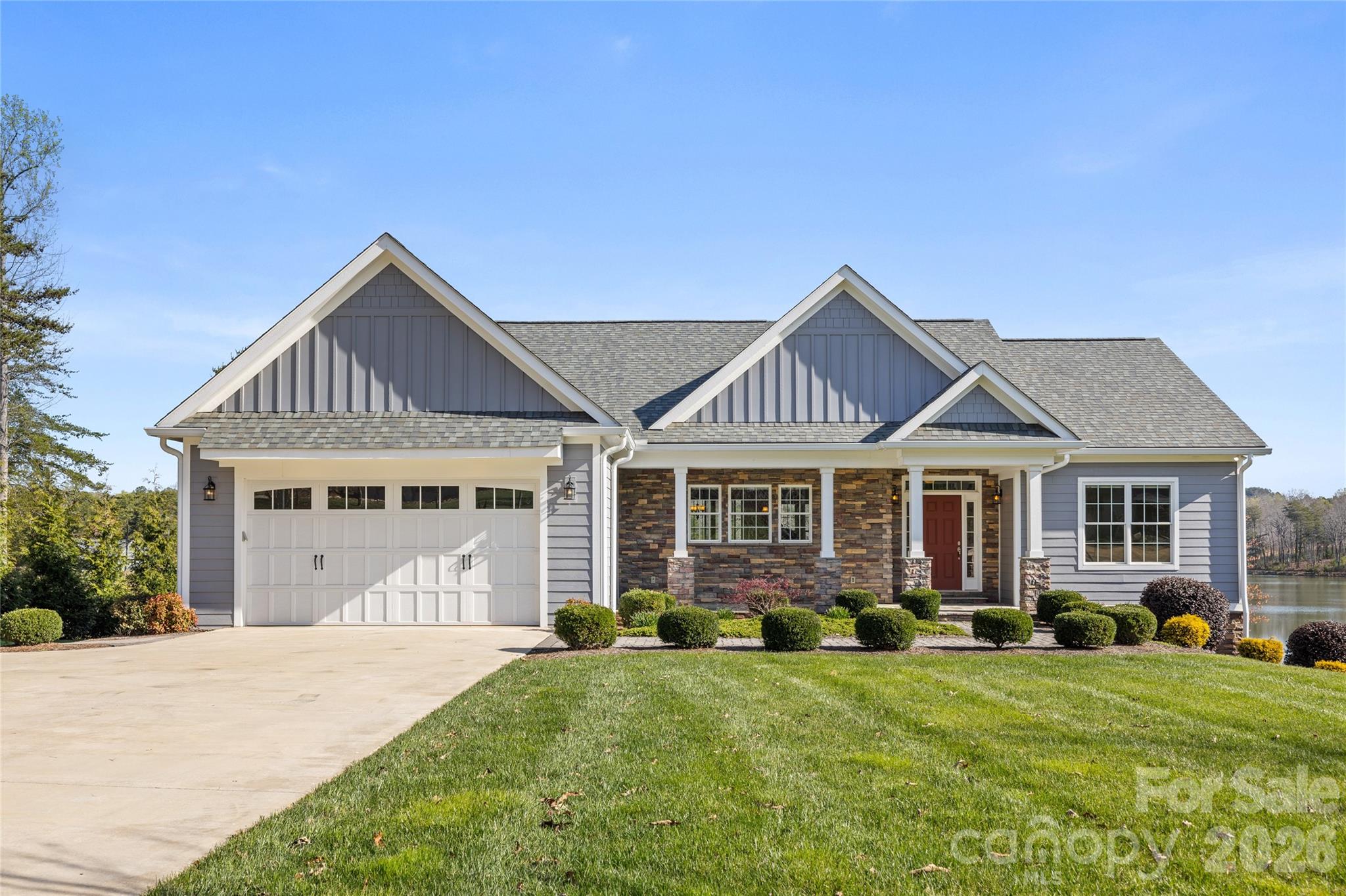 Peaceful lakefront retreat in the gated community of Derbyshire in Columbus, NC, offering both waterfront living and full equestrian amenities. This 3-bedroom home features all main living on one level plus a full walkout basement, giving you comfort, flexibility, and extra space. The main floor includes three well-sized bedrooms, a comfortable main living area and an easy-flow layout that takes advantage of serene lake views. The full walkout basement adds a large family/rec room and a full bath—ideal for guests, hobbies, or a separate hangout space. Large windows and direct access to the outdoors make the lower level feel bright and connected to the lakefront setting. Outside, enjoy peaceful water views, outdoor living space for relaxing or entertaining and direct access to Derbyshire’s private lake lifestyle. The gated community offers equestrian amenities with options for boarding, making this a rare blend of lake and horse country living. Conveniently located just minutes to Landrum, SC and the Tryon International Equestrian Center, this property puts you close to shopping, dining, and world-class equestrian events while still feeling as though at a private retreat!