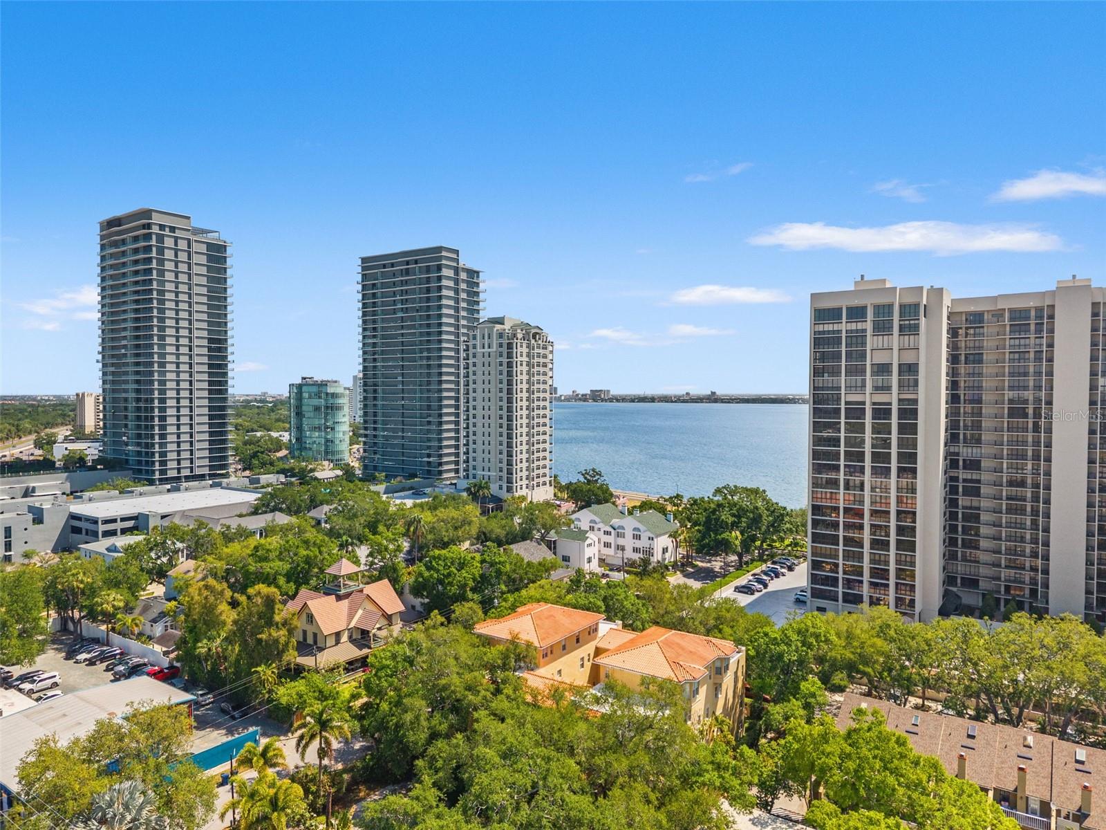 Just one block from iconic Bayshore Boulevard, this beautifully updated, corner unit townhome is located within a gated community and offers the perfect blend of style, comfort, and location.Recently renovated, the kitchen is a standout feature with crisp white shaker cabinetry, quartz countertops, stainless steel appliances, a built-in bar, and new flooring that flows seamlessly throughout the main living areas. Fresh paint enhances the bright, airy feel of the home.French doors open to charming balconies, bringing in natural light and creating an effortless indoor outdoor connection. Downstairs, enjoy your own fully fenced private patio, ideal for entertaining, relaxing, or letting pets roam freely.This spacious layout includes two bedrooms, two and a half baths, plus two versatile bonus spaces. There is an ideal downstairs office or flex room, along with a loft area adjacent to the bedrooms on the third floor, perfect for a second living space, workout area, or cozy retreat. An attached two car garage adds convenience and additional storage.With no lease restrictions, this home offers incredible flexibility for both end users and investors. A rare opportunity to live just steps from Bayshore, with easy access to Tampa’s best dining, shopping, and waterfront living.