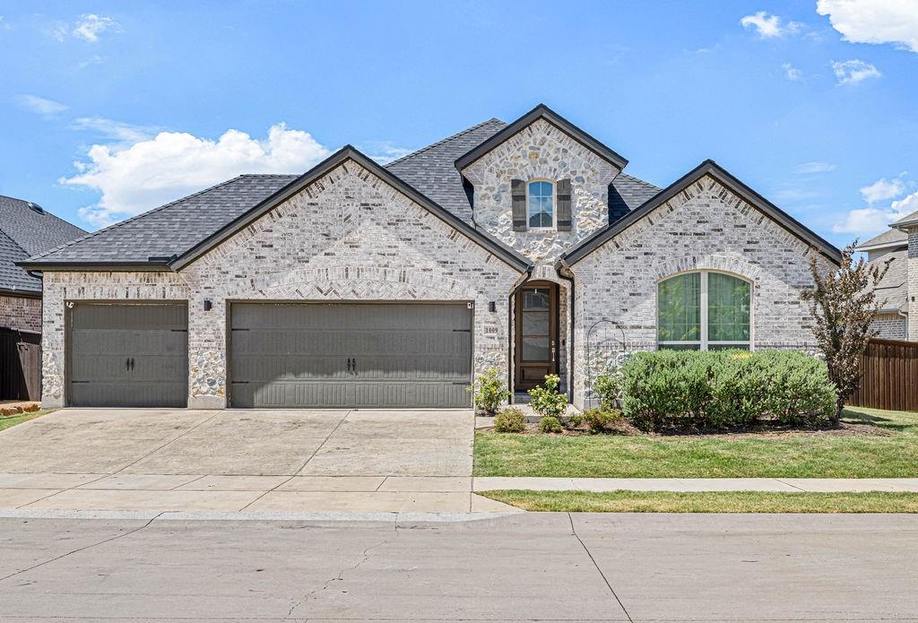 Welcome to this one-story gem in the sought-after Light Farms community, offering 3 bedrooms, 2 full baths, a powder bath, dedicated study, and an impressive 4-car garage. The open-concept layout features vaulted ceilings and large windows that fill the home with natural light.The bright, inviting kitchen showcases white shaker-style cabinetry, quartz countertops, and a spacious island, while a built-in desk in the breakfast nook provides a convenient workspace. The spacious primary suite features a charming bay window and an ensuite bath , an extended vanity with dual sinks, and a walk-in shower. Additional bedrooms are spacious and feature walk-in closets for excellent storage. New carpet was recently installed throughout the rooms and closets. A standout feature is the expansive garage, upgraded with custom epoxy flooring with heating and air conditioning. This comfortable, finished space offers incredible flexibility for hobbies or projects, a home gym, car enthusiasts, or additional year-round workspace.Outside, enjoy the large backyard with a covered patio and extended patio space, perfect for entertaining or relaxing outdoors. JellyFish exterior lighting, installed along the front of the home in December, adds customizable year-round accent and holiday lighting with a clean, seamless look.Residents of Light Farms enjoy award-winning amenities, including pools, parks, trails, fitness facilities, tennis courts, and year-round community events. All of this, plus highly rated Prosper ISD, makes this an exceptional place to call home.