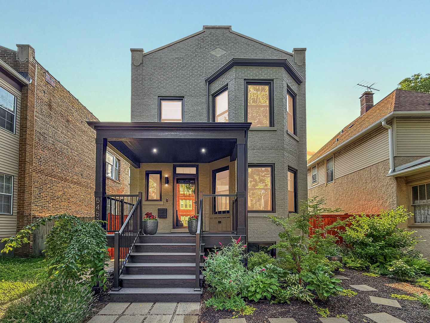 Originally built in 1914 and reimagined in 2022, this Andersonville residence blends timeless charm with modern design. What began as a classic 3-flat has been meticulously transformed into a stunning single-family home by builder MJZ Home Design, architect Andrew Ivari, and the design team at Aussie Bear. Nearly every element is brand new - the only pieces of its past that remain are the brick walls and floor joists - everything else has been thoughtfully rebuilt to today's highest standards. Spanning 5 bedrooms and 4 full baths, the home offers an open-concept main level where the living room, dining room, and chef's kitchen flow seamlessly to a large back deck and fenced yard, ideal for everyday living and entertaining. Abundant natural light pours in from the wide lot, enhanced by the added side yard. The second level hosts 3 spacious bedrooms, including a serene primary suite with a private deck overlooking the backyard. At the top of the stairs, a dedicated office nook provides the perfect work-from-home setup. Every level is complete with a full bathroom - including the finished basement, which also features a mudroom with an oversized sink and second laundry hook-up. Outdoors, enjoy a beautifully designed backyard with a fire pit for cozy evenings, plus a 2-car detached garage. With brand-new plumbing, electric, windows, HVAC, roof, and more, this home is truly move-in ready. Located in the heart of Andersonville, you'll be moments from vibrant shops, acclaimed restaurants, and the warm community atmosphere that makes this neighborhood so special.