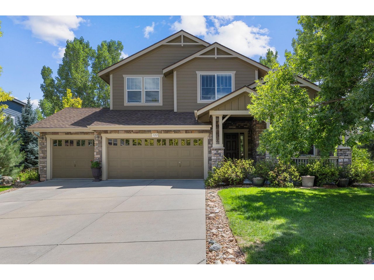 Welcome home to 122 Peregrine Lane, a stunning 5-bedroom, 4-bath home tucked into the beautiful Stone Canyon community in Lyons, where thoughtful design, generous living spaces, and spectacular Colorado surroundings come together. Inside, soaring ceilings and expansive windows fill the home with natural light, while hickory hardwood floors extend throughout the main level. An inviting sitting room is anchored by a double-sided gas fireplace that connects seamlessly to the spacious living/dining area beyond. The kitchen and dining areas create the heart of the home, with granite countertops, abundant cabinetry and storage, a breakfast bar, and an easy flow designed for both everyday living. Also on the main level, a dedicated office paired with a full bathroom offers exceptional flexibility-perfect for working from home or creating a private additional main floor bedroom. Upstairs, a **rare four-bedroom layout** keeps everyone comfortably together on one level. The spacious primary suite is a peaceful retreat with a walk-in closet, en suite bath, and private balcony, while three additional bedrooms and two more full bathrooms offer plenty of room for family and guests. It's a wonderfully functional floor plan that can be surprisingly hard to find in the Boulder County foothills. The unfinished walkout basement is flooded with natural light and offers an incredible opportunity to expand. Outside, generous landscaping creates a lush backyard with plenty of space to play, garden, entertain, or simply unwind. A three-car garage provide ample room for vehicles, outdoor gear, bikes, and all the toys that come with Colorado living. Perched on a quiet cul-de-sac, the home offers a wonderful sense of privacy while remaining remarkably connected-just 12 minutes from both Boulder and Longmont and a quick golf-cart ride into the town of Lyons. From hiking and biking to fishing and tubing along the St. Vrain, outdoor adventure is never far away.