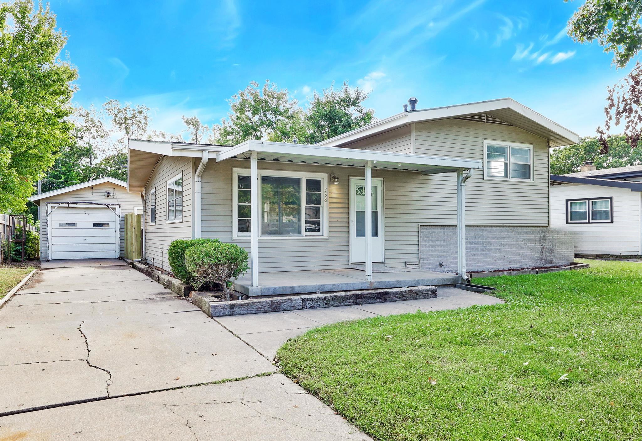 Charming & Fully Updated Home in the Heart of Haysville!  Welcome to 238 S. Western, a beautifully renovated home that blends modern finishes with timeless comfort. This move-in-ready property features brand-new flooring throughout, fresh interior paint, and a range of stylish upgrades designed to impress. Step inside and enjoy a light-filled living area that flows seamlessly into the updated kitchen, complete with granite countertops, freshly painted cabinetry, and plenty of prep and storage space—perfect for both everyday living and entertaining.  The bathrooms have been fully refreshed with gorgeous new tile showers, adding a touch of spa-like luxury to your daily routine. Every detail has been thoughtfully updated to offer both function and style.  Outside, you'll find a spacious yard ideal for relaxing, playing, or gardening.  Also a detached garage.  Conveniently located near schools, parks, and shopping, this home offers the perfect combination of peaceful suburban living with easy access to amenities.  Don’t miss your chance to own this turnkey gem in a quiet Haysville neighborhood.  Call listing agent today for your showing!!