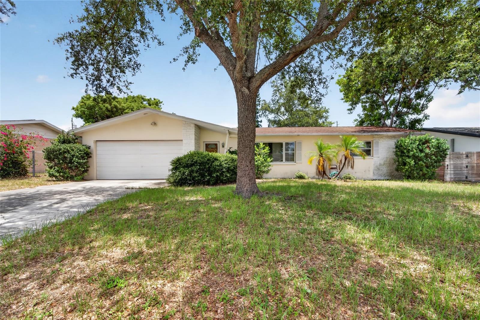 Virtually Staged. Welcome to 1342 Edmonton Drive, a well-maintained 2-bedroom, 2-bath home offering comfort, flexibility, and endless potential in a convenient Clearwater location. Situated on an oversized .20-acre lot, this property features approximately 1,040 square feet of living space plus a spacious Florida room that expands your options for everyday living. Whether you envision a home office, fitness room, game room, craft space, or additional entertaining area, this versatile bonus space can easily adapt to your needs. Inside, you'll find a functional floor plan with comfortable living areas, generously sized bedrooms, and abundant natural light throughout. The kitchen offers plenty of cabinet and counter space while maintaining easy access to both the main living areas and Florida room, creating a seamless flow for daily living and entertaining. Step outside and discover a large backyard with ample room for gardening, pets, outdoor gatherings, or future enhancements. A storage shed provides additional space for tools and equipment, while the attached garage offers convenience and extra storage options. For added peace of mind, the roof was replaced in 2017. Located just minutes from shopping, dining, parks, medical facilities, and the award-winning Gulf beaches, this home combines a desirable location with exceptional potential. Whether you're a first-time homebuyer, seasonal resident, investor, or someone looking to downsize without sacrificing outdoor space, 1342 Edmonton Drive presents an outstanding opportunity to make it your own. Schedule your private showing today and explore all the possibilities this Clearwater home has to offer.