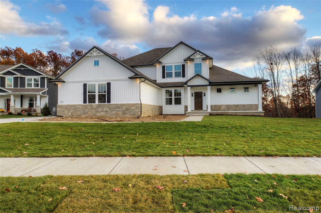 Welcome to the Bristol plan featuring a first-floor primary suite and an amazing 2 story great room built by Capital Custom Homes. This home is to be built and has a 7-8 month built time from contract. With over 2800 sqft this incredible home features 4 bedrooms, 2.5 baths, 3 car, truck friendly, 24' deep garage and   home office.  The great room has floor-to-ceiling windows and features a gas fireplace with stone accent to ceiling. Rare find first-floor primary suite is just the oasis you're looking for with a large tiled shower, dual his/her vanities, and spacious walk-in closet.  Three ample-sized bedrooms on the second floor all with walk-in closets.  The well-designed kitchen overlooks the bright eat-in nook and is highlighted by a large 7'  island, with a corner pantry, cabinets with soft-close doors and drawers, and quartz countertops throughout.  Homesite backs to wooded common area. Sod and irrigation included. This home comes with Capitals Completely Connected Home Smart Technology package, 9' Superior basement walls fully insulated to an R16 plumbed for future finish and a 5-year structural warranty & 1 yr builder warranty. 96% Efficiency furnace and A/C and 50 gal HWH. Community features Sidewalks, streetlights, fishing pond, play area and sports field. Close to shopping, freeways, and restaurants. Don't miss this opportunity to buy now and skip the bidding wars.  Stock photos. Marion Oaks is Livingston County's premier community in the heart of Howell. Built by Capital Custom Homes. June/July Completion.