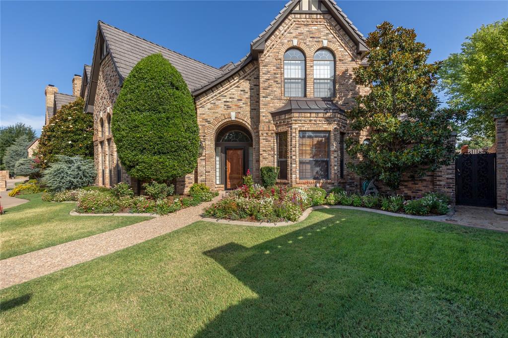 Located in the prestigious Brookhaven Square, this stunning residence showcases immaculate landscaping, fantastic brickwork, and soaring ceilings that create a sense of elegance from the moment you arrive. Inside, the formal dining, living, and entryway feature dramatic grand room ceilings, while the rest of the home offers 12-foot ceilings, crown molding, and custom finishes throughout. A stately executive study with French doors and a spacious den with an elegant fireplace and fine woodwork add to the refined character. The gourmet kitchen boasts a breakfast bar, abundant counter space, backsplash, matching cabinetry with wine racks, and walk-in pantry with spice rack. Appliances include a double oven, Jenn-Air gas cooktop with downdraft venting, Kenmore Elite refrigerator, and built-in microwave. The luxurious master suite features tall windows with elegant curtains, a spa-like bath with Jacuzzi tub, separate shower, dual vanities, and private water closet, plus an expansive walk-in closet with built-in cabinetry and shoe racks. Upstairs offers two large bedrooms, each with its own full bath, a cozy sitting area, and a secondary utility room that can serve as laundry or kitchenette space. Outdoor living is unmatched with French doors leading to a lovely brick porch with outdoor speakers and gas hookups for grilling or a hot tub. The backyard is a private retreat with lush landscaping, wood-like deck space, an iron gates, and a 6-foot brick privacy wall. *Additional highlights include: DaVinci roof, hardwood floors and high-end carpet, built-in granite-top buffet in dining area, downstairs laundry room with built-ins and stainless sink, central vacuum system and built-in whole-home speakers, oversized two-car garage with wash bin and attic-lift, two AC units for comfort and efficiency. A rare opportunity to own an executive-style home in Brookhaven Square, blending timeless elegance, modern function, and complete privacy. Close to I-35, shopping and entertainment.