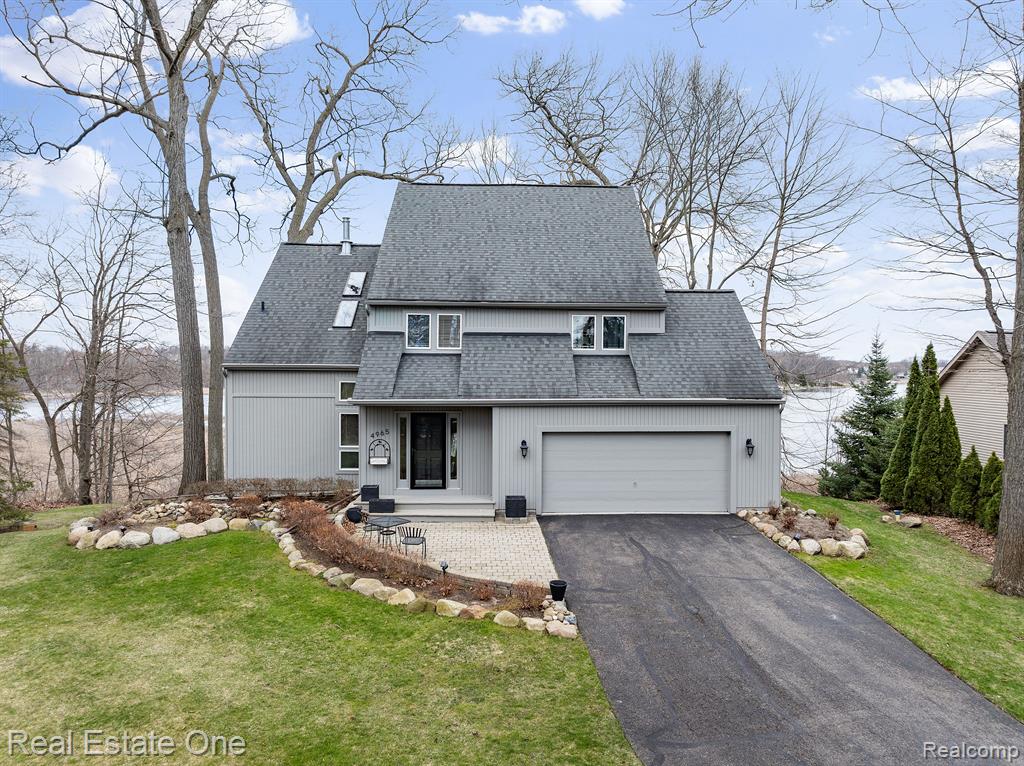 Live the Lake Life - with a view Worth Every Penny. This meticulously crafted contemporary lakefront retreat is ideally positioned on 121 Ft of Crooked Lake Bay frontage, offering breathtaking vistas that embody the essence of lakeside living. Imagine waking up to serene water views daily—this property represents a home and a lifestyle. Upon entering, you’ll find a spacious foyer leading into an inviting open-concept layout, where wood floors radiate warmth and elegance. The attention to detail is evident throughout, highlighted by shaker doors that enhance the modern aesthetic. The living area features vaulted ceilings and a picture window that showcases stunning lake views. The gourmet kitchen, truly a chef’s dream, includes stainless steel appliances, granite countertops, custom cabinetry, and remarkable craftsmanship in every aspect. Retreat to the upper-level primary bedroom, a true sanctuary complete with an opulent ensuite bathroom. Step out onto your private balcony to savor morning coffee or unwind in the evening while soaking in stunning sunset views. This home also offers two additional bedrooms, plus a professionally finished walkout basement equipped with a full bathroom and 4th spacious bedroom—ideal for guests or as an entertainment area. This versatile area connects seamlessly to the outdoors, where your private dock awaits for summer fun filled with swimming, fishing, or basking in the sun. Whether you're hosting gatherings or embracing tranquil evenings by the water, this property presents countless opportunities for relaxation and recreation. The expansive outdoor space invites you to immerse yourself in nature's beauty. Notables Inc: New Furnace 2019, New Boiler 2018, New A/C 2019, Wired for Generator. Don’t let this incredible opportunity slip away! Arrange your private showing today and uncover what makes this lakefront treasure unique. Your dream home is waiting!