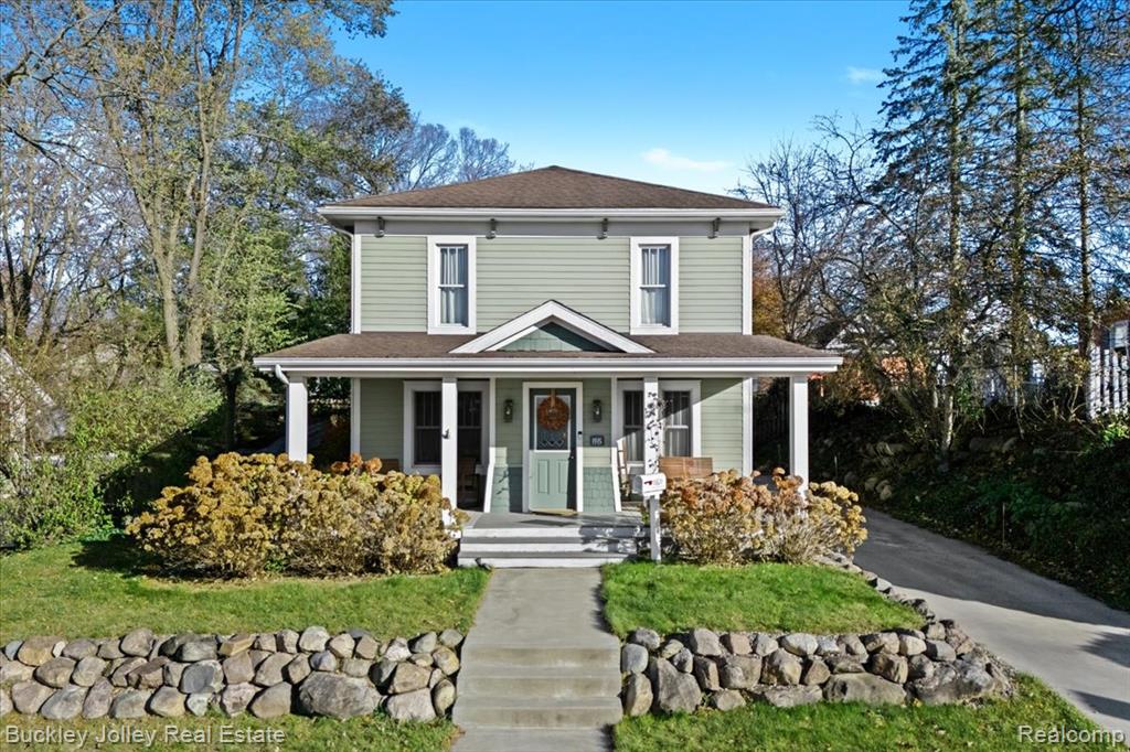 Step into Brighton’s vibrant downtown lifestyle with this beautifully preserved and thoughtfully updated historic home. Blending rich history with modern comfort, this home features original wood flooring, coved ceilings, and select historic lighting that highlight its unique character. The spacious floor plan offers multiple options for a home office, or additional gathering spaces.The kitchen and baths have been updated. The primary bedroom was expanded and includes soaring ceilings and a huge walk-in closet. The basement is block foundation not original to the home and is dry and offers excellent storage as well as a half bath. The updates that count have been made here including Hardy Siding, windows, electric, furnace and so much more. Relax on the stunning front porch the sellers added, framed by beautiful hydrangeas. The property also includes an oversized 2-car detached garage added by sellers, plus a shed for extra storage. Just a short walk to downtown’s renowned festivals, restaurants, shopping, and farmers markets. Additional historical details can be found in the disclosures. Truly an exceptional location with the perfect blend of heritage and modern livability.