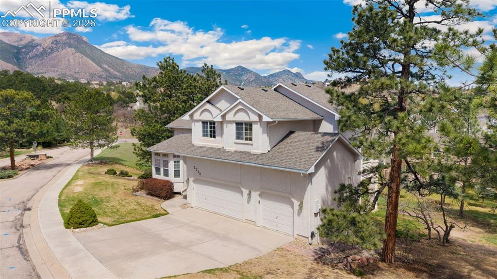 Located in the highly desirable Peregrine neighborhood, this bright, sunny, and open home offers an exceptional floor plan, generous living spaces, and stunning mountain views. The main level welcomes you with formal living and dining rooms featuring soaring vaulted ceilings and walls of windows that fill the home with natural light. A dedicated main level home office provides the perfect space for working from home or a quiet study. Brand new carpet on the main and upper levels adds a fresh, move-in ready feel. The spacious kitchen includes a sunny dining nook that walks out to a brand new deck completed in 2024, perfect for enjoying Colorado evenings and taking in the gorgeous views. Just off the kitchen, the inviting family room with fireplace creates a warm and comfortable gathering space. A convenient main level laundry room and an oversized 3-car garage add to the home’s functionality. Upstairs, the expansive primary suite offers a true retreat with a luxurious 5-piece bath and plenty of space to unwind. Three additional upper-level bedrooms and a full hall bath with dual vanity provide room for family, guests, or flexible use. The walk-out basement expands the living space with a large rec room, a fifth bedroom, and a full bath, ideal for guests or multi-generational living. Situated on a huge lot, this home provides both privacy and room to enjoy the outdoors. Additional updates include a newer roof and deck, both completed in 2024, offering peace of mind and modern appeal. Located just down the street from Woodmen-Roberts Elementary School and within close proximity to trails, parks, and all that Peregrine has to offer. With an easy commute to anywhere in Colorado Springs or Denver, this home combines comfort, convenience, and value in one of the area’s most sought-after communities. Don’t miss this incredible opportunity.