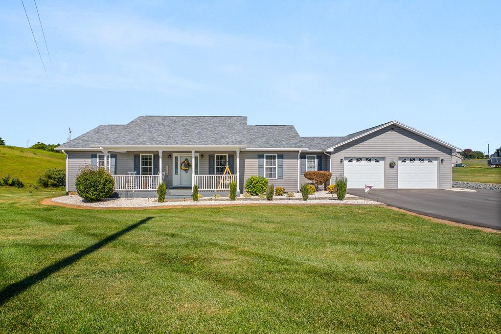 Immaculate three bedroom two and a half bath all on one level home that features hardwood flooring, a remodeled kitchen in 2018 with granite countertops, a new paved driveway in 2024, a large pantry, two car garage, new roof and gutters in 2021, new heat pump in 2020, paved drive, an outbuilding, and all kitchen appliances convey! This beautiful home sits on two lots totaling 1.368 acres and is located in a great neighborhood convenient to Galax and Hillsville!