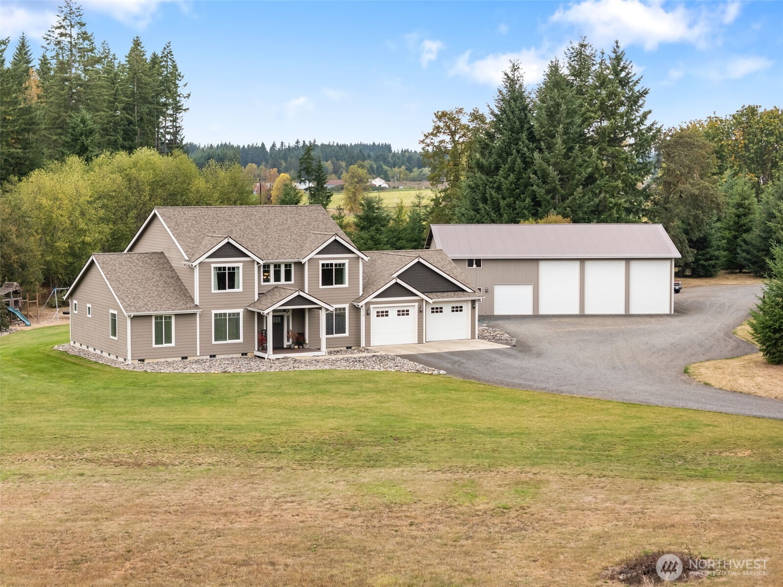 Impressive country estate filled w/ loads of custom upgrades! This impeccably maintained home is 3,500 sq ft offering 9’ ceilings, 4+ bedrooms (all w/ walk-in closets), 3.5 baths, office/den, & multiple living spaces. Chef’s kitchen w/ 5 burner Kenmore range, double ovens, stainless range hood, butler’s & walk-in pantries. Luxurious primary suite w/ 5-piece bath & dual closets. Home is equipped w/ HVAC system w/electrostatic air cleaner & variable speed fan. Dbl walls insulation in key areas for soundproofing. Enjoy a 400’ covered deck, low-maintenance landscaping, 30 GPM well, and heated 882’ garage. Exterior repainted in 24’.  Plus, a 60x42 insulated shop w/ loft, bath, laundry, wood stove, & separate 100 AMP service. RV hookup – 50 AMP.